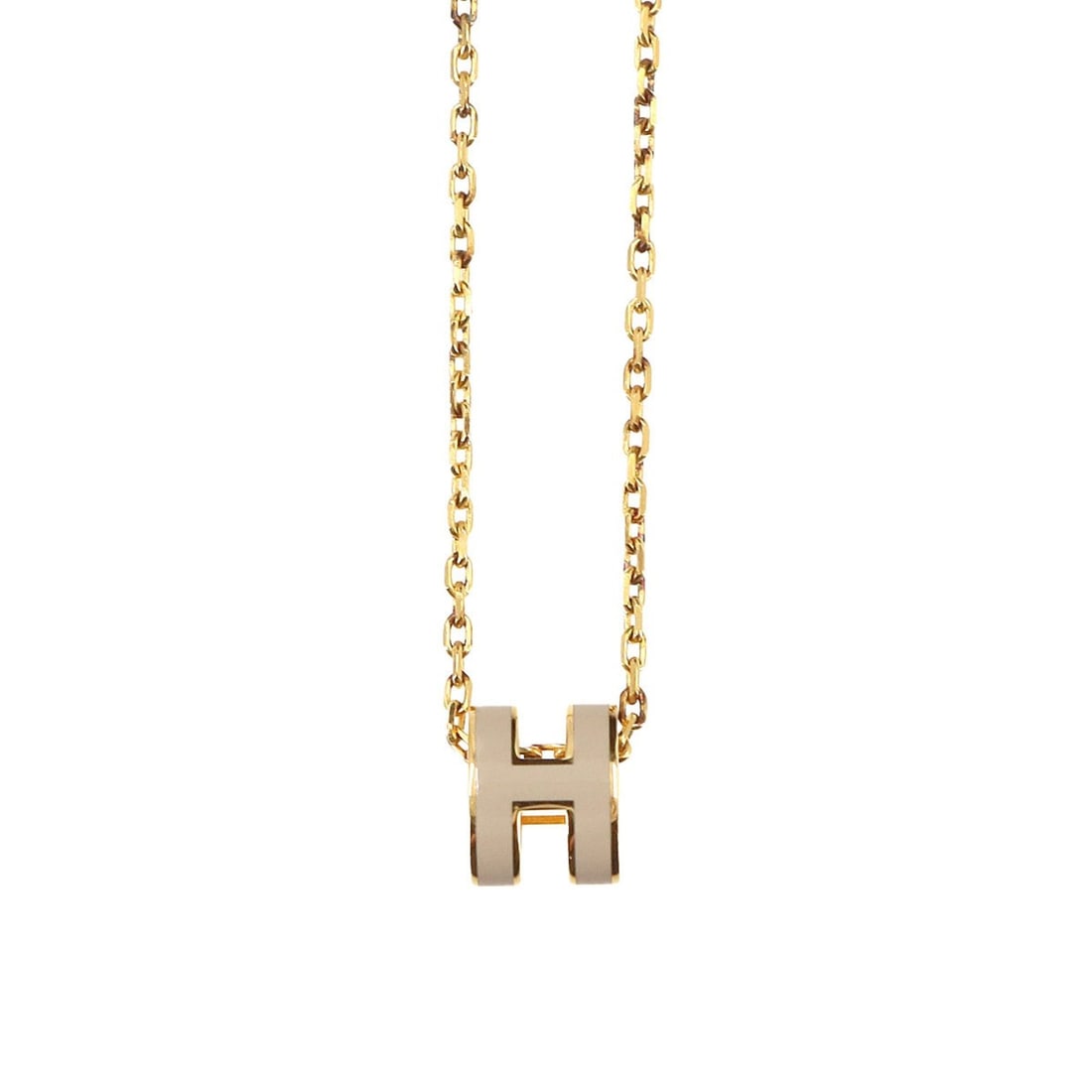 Hermes Mini Pop H Necklace, Marron Glacé Gold: --- Catalog ---Category: SizePendant Size: 9mm x 7mm / 0.35'' x 0.27''Neck Circumference: 39.5 cm / 15.55''Category: DesignColor: Beige, Gold, MarronGender: WomenNecklace Type: NecklaceCategory: Gener