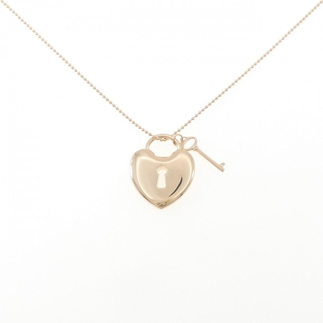 Tiffany Heart Lock Necklace: --- Catalog ---Category: SizePendant Size: 21.7mm x 17.7mm / 0.85'' x 0.69''Neck Circumference: 41 cm / 16.14''Category: DesignGender: WomenMaterial: Pink gold (18K)Pendant Type: PendantNecklace