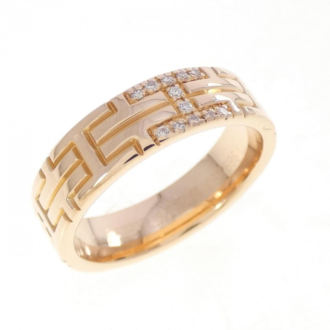 Hermes Kilim Ring: --- Catalog ---Category: SizeUS Size: 4.5Brand Size: 48Category: DesignType: Band ringStone: DiamondGender: WomenMaterial: Pink gold (18K)Category: GeneralBrand: Hermes--- Item List ---Section: