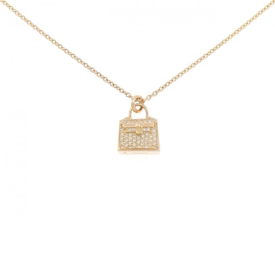 Hermes Kelly Necklace 0.21CT: --- Catalog ---Category: SizePendant Size: 14.7mm x 11.7mm / 0.57'' x 0.46''Neck Circumference: 38 cm - 40 cm / 14.96'' - 15.74''Category: DesignColor: Pink goldStone: DiamondGender: WomenMaterial: