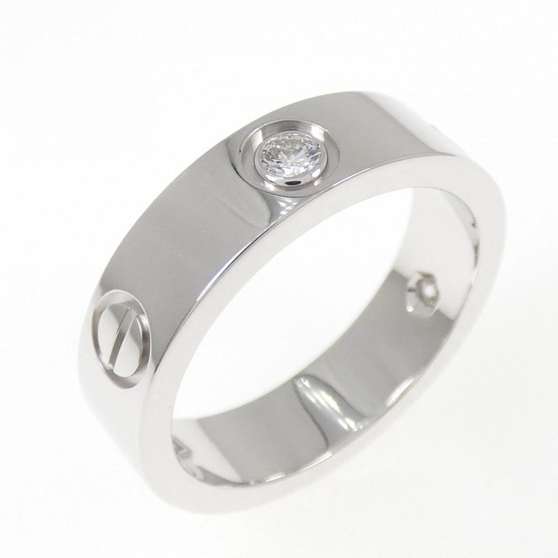Cartier Love Half-Diamond Ring: --- Catalog ---Category: SizeUS Size: 8Brand Size: 56Category: DesignType: Band ringStone: DiamondGender: WomenMaterial: White gold (18K)Category: GeneralBrand: Cartier--- Item List ---Section: Condit