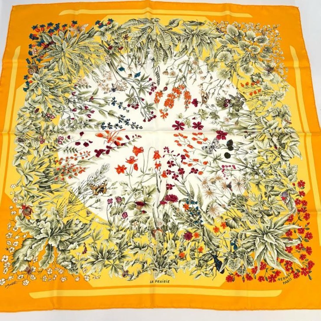 Hermes Carre 90 La Prairie Silk Scarf/Muffler, Orange: --- Catalog ---Category: SizeSize (LxW): 88.5cm x 88cm / 34.84'' x 34.64''Category: DesignType: ScarfColor: OrangeGender: WomenMaterial: Silk Category: GeneralBrand: Hermes--- Item List ---Section: Co