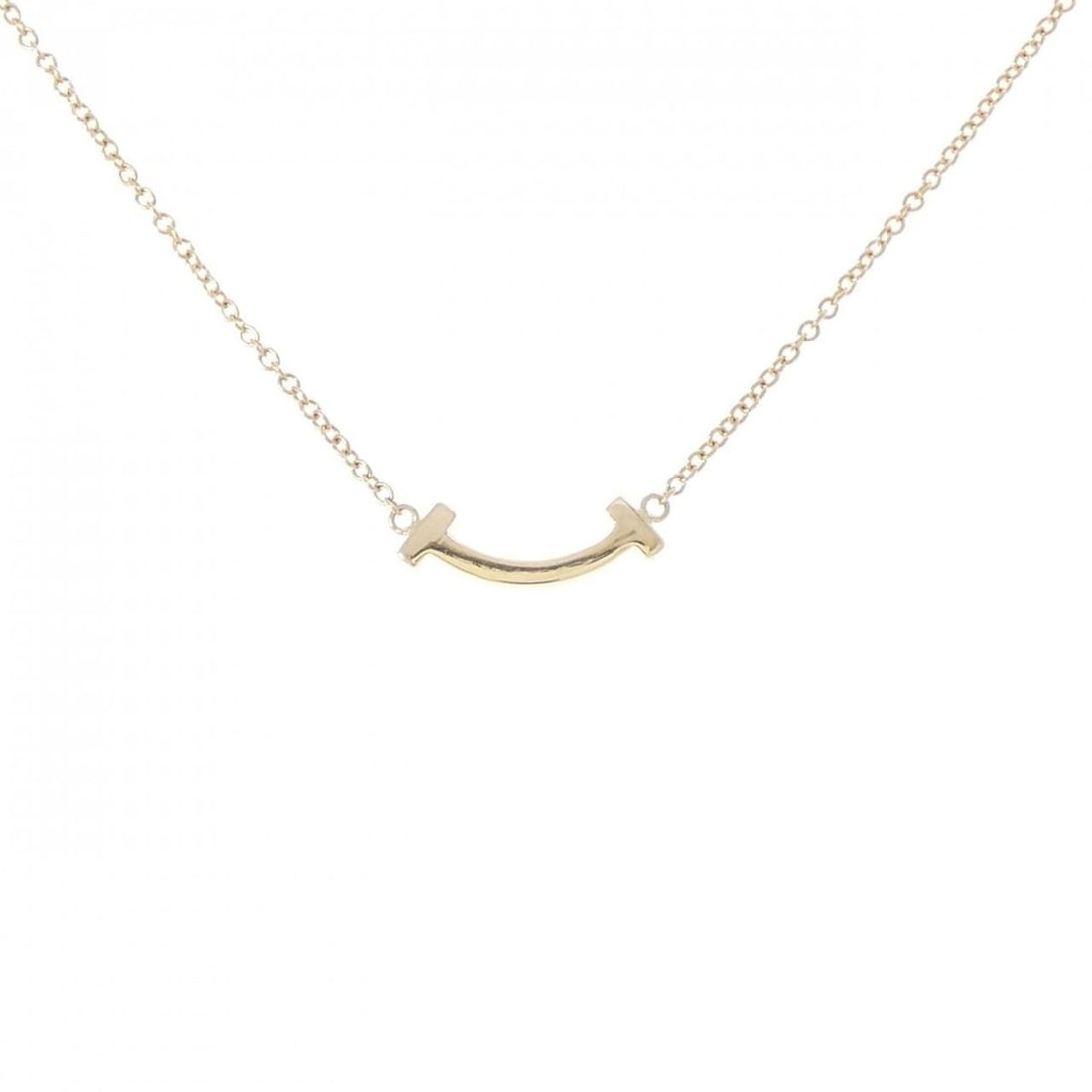 Tiffany T Smile Mini Necklace: --- Catalog ---Category: SizePendant Size: 4.3mm x 13.2mm / 0.16'' x 0.51''Neck Circumference: 41 cm - 46 cm / 16.14'' - 18.11''Category: DesignGender: WomenMaterial: Yellow gold (18K)Pendant Type:
