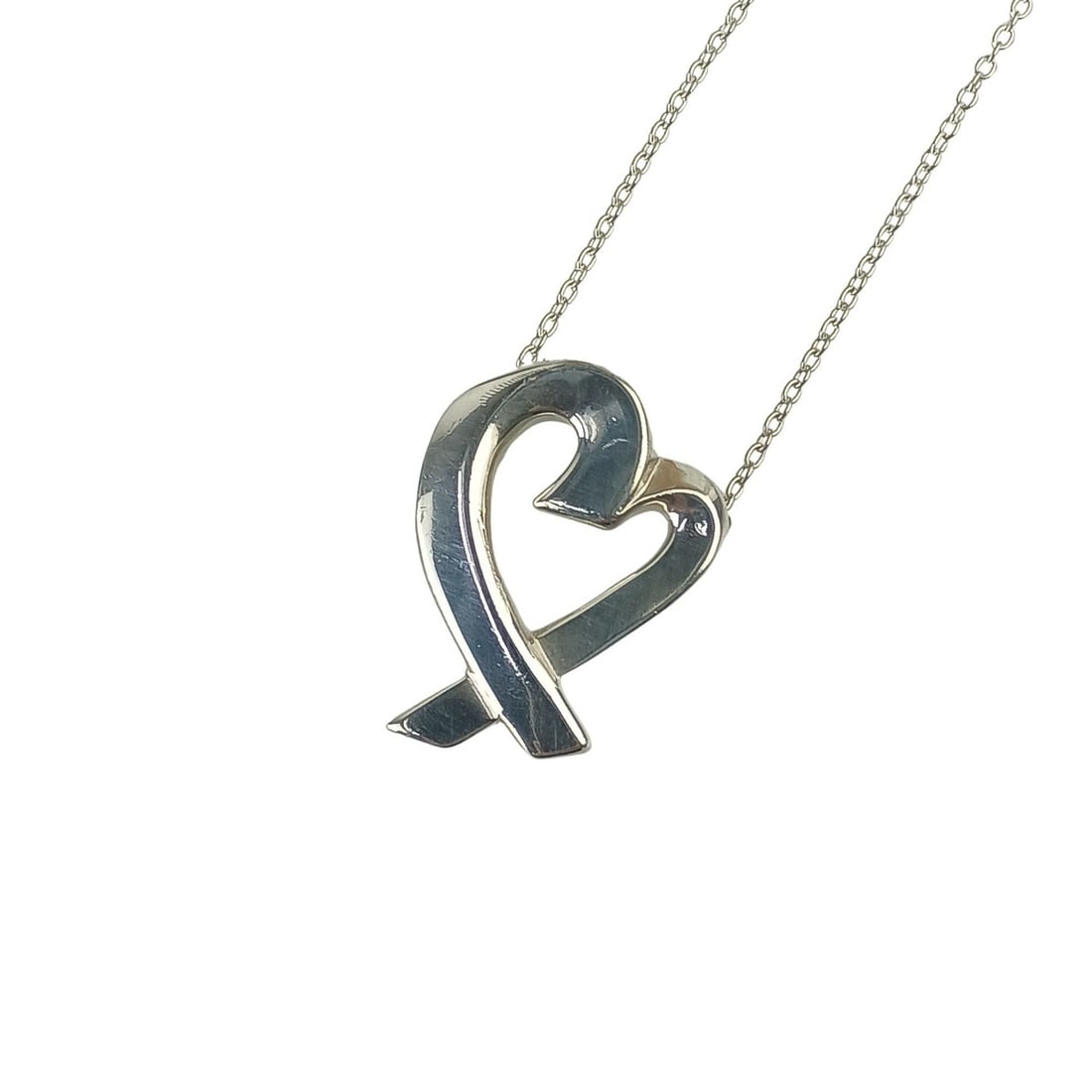 TIFFANY & Co. Paloma Picasso Loving Heart Big Silver Necklace (SV925) for Women: --- Catalog ---Category: SizeWeight: 5.2g / 0.18oz.Pendant Size: 20mm x 15mm / 0.78'' x 0.59''Neck Circumference: 53 cm / 20.86''Category: DesignGender: WomenMaterial: Silver 925Pendant Type: PendantN