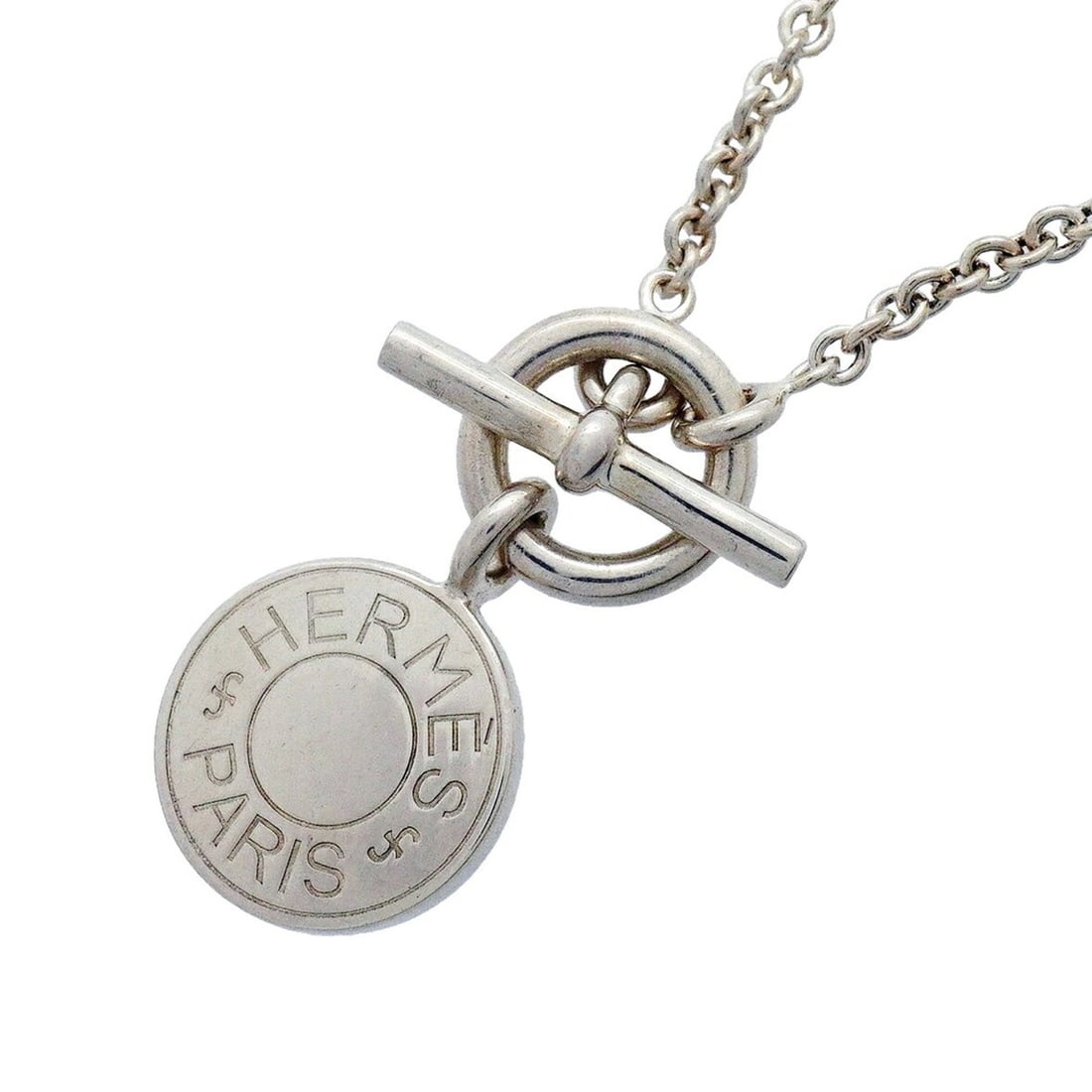 Hermes Necklace, Sellier Amulette, Sterling Silver 925, Women's, OP012262: --- Catalog ---Category: SizePendant Size: 19.2mm x 13.9mm / 0.75'' x 0.54''Neck Circumference: 40 cm / 15.74''Category: DesignGender: WomenMaterial: Silver 925Pendant Type: AmuletNecklace Type: Neckl