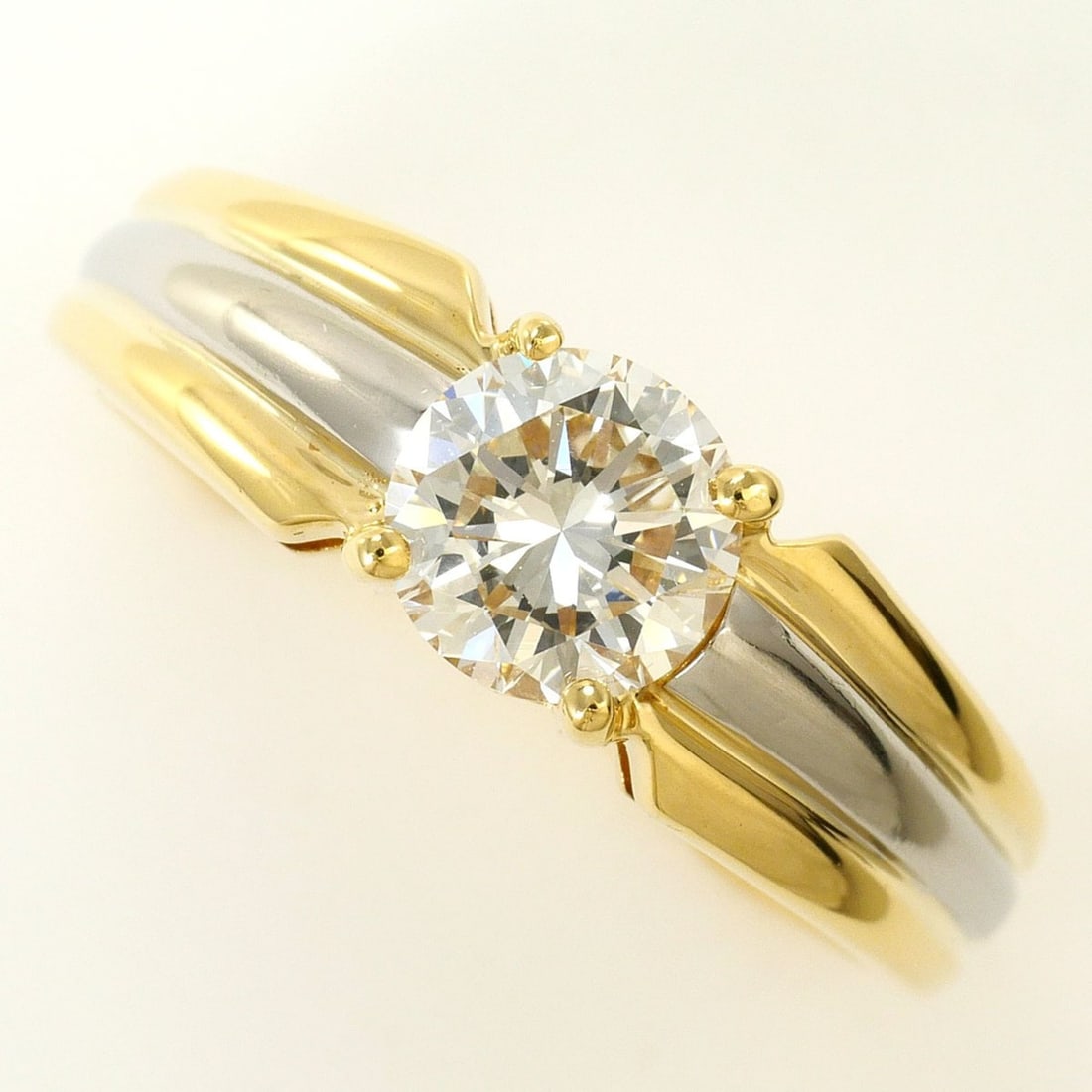 PT900 Platinum 18K Yellow Gold Ring with 0.75ct Diamond (VS2 clarity) and Certificate of: --- Catalog ---Category: SizeWidth: 6mm / 0.24''Weight: 5.6g / 0.19oz.JP Size: 11US Size: 6Category: DesignType: Band ringColor: Platinum, Yellow goldMetal: GoldStone: DiamondGender: WomenMaterial: Pl