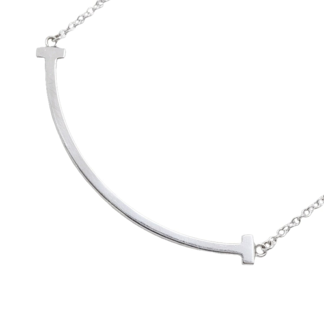 Tiffany & Co. T Smile Small Necklace, 18K White Gold, Women's: --- Catalog ---Category: SizePendant Size: 10mm x 37.1mm / 0.39'' x 1.46''Neck Circumference: 40.5 cm - 45 cm / 15.94'' - 17.71''Category: DesignGender: WomenMaterial: White gold (18K)Necklace Type: N