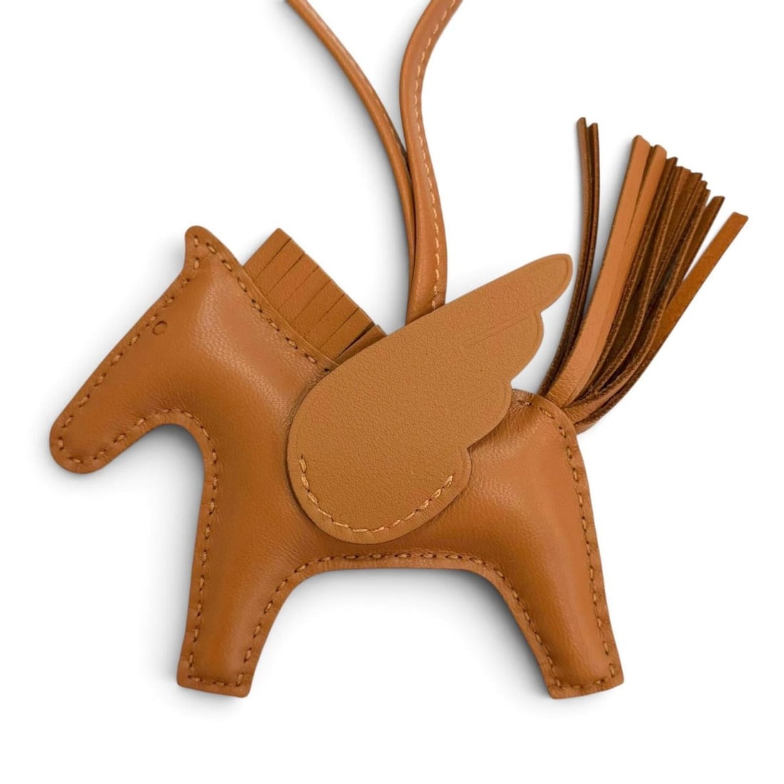 HERMES H083010CABI Rodeo Charm Pegasus PM Agneau Milo Swift So Gold Bag W Stamp Made in France: --- Catalog ---Category: SizeSize (HxWxD): 75.00mm x 110.00mm / 2.95'' x 4.33''Category: DesignType: Handbag charmGender: WomenMaterial: Agneau Milo, Swift leatherCategory: GeneralMPN: H083010CABIBran