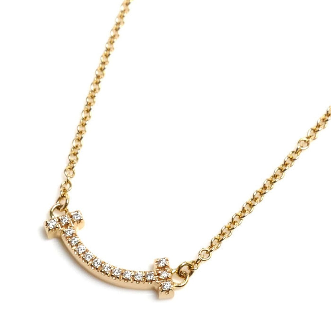 TIFFANY&Co. Tiffany 18K Yellow Gold T Smile Mini Necklace 62617683 Diamond 2.3g Size 41-46cm Women's: --- Catalog ---Category: SizePendant Size: 3.7mm x 13mm / 0.14'' x 0.51''Neck Circumference: 41 cm - 46 cm / 16.14'' - 18.11''Category: DesignStone: DiamondGender: WomenMaterial: Yellow gold (18K)Neck