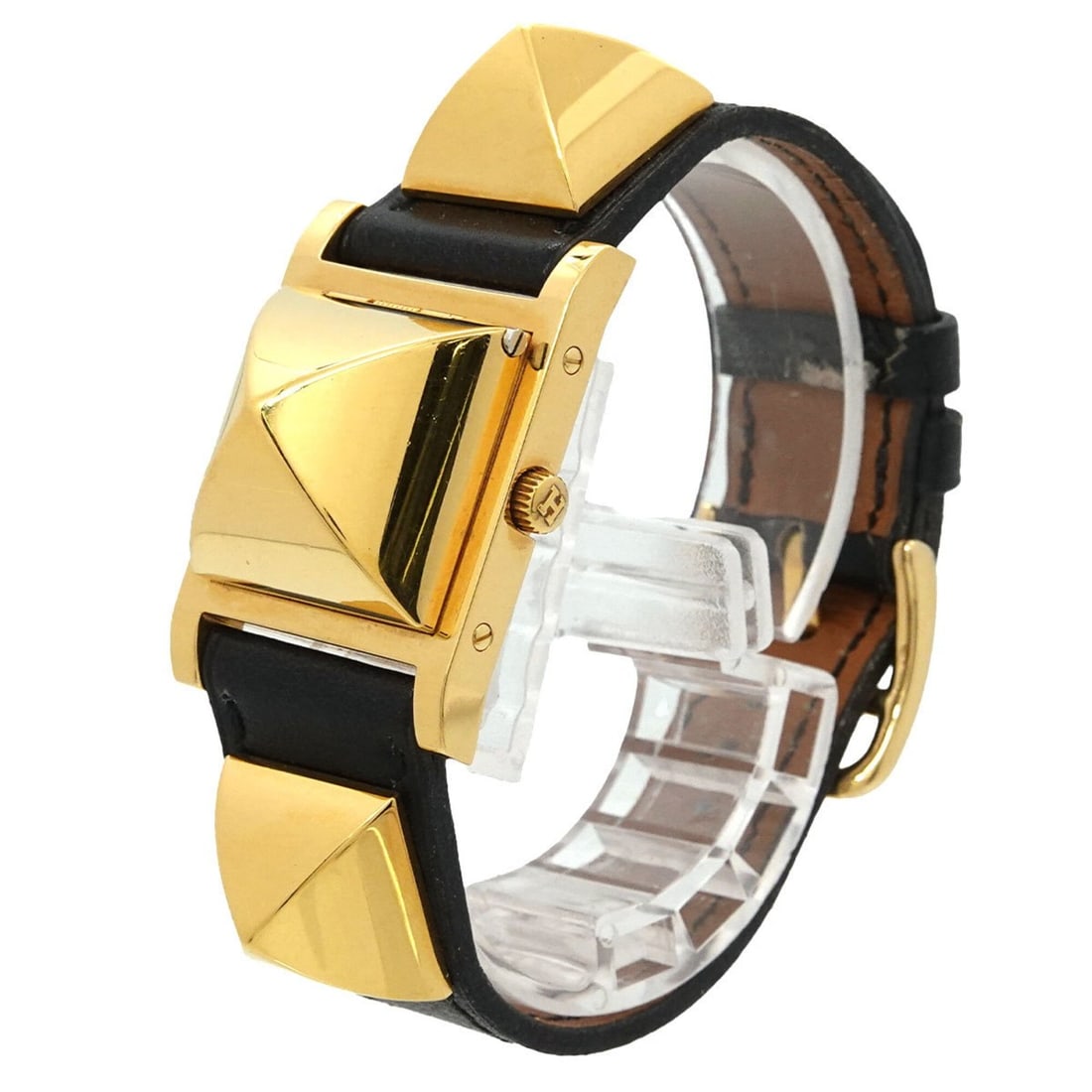 Hermes Medor Women's Watch, Pyramid Design, Gold Studs, White & Black Leather Strap, Quartz: --- Catalog ---Category: SizeWrist Size: 13.5cm - 16cm / 5.31'' - 6.29''Case Diameter: 23mm / 0.91''Category: DesignType: WristwatchGender: WomenColor (Dial): WhiteMaterial (Band): Gold plated, Leathe