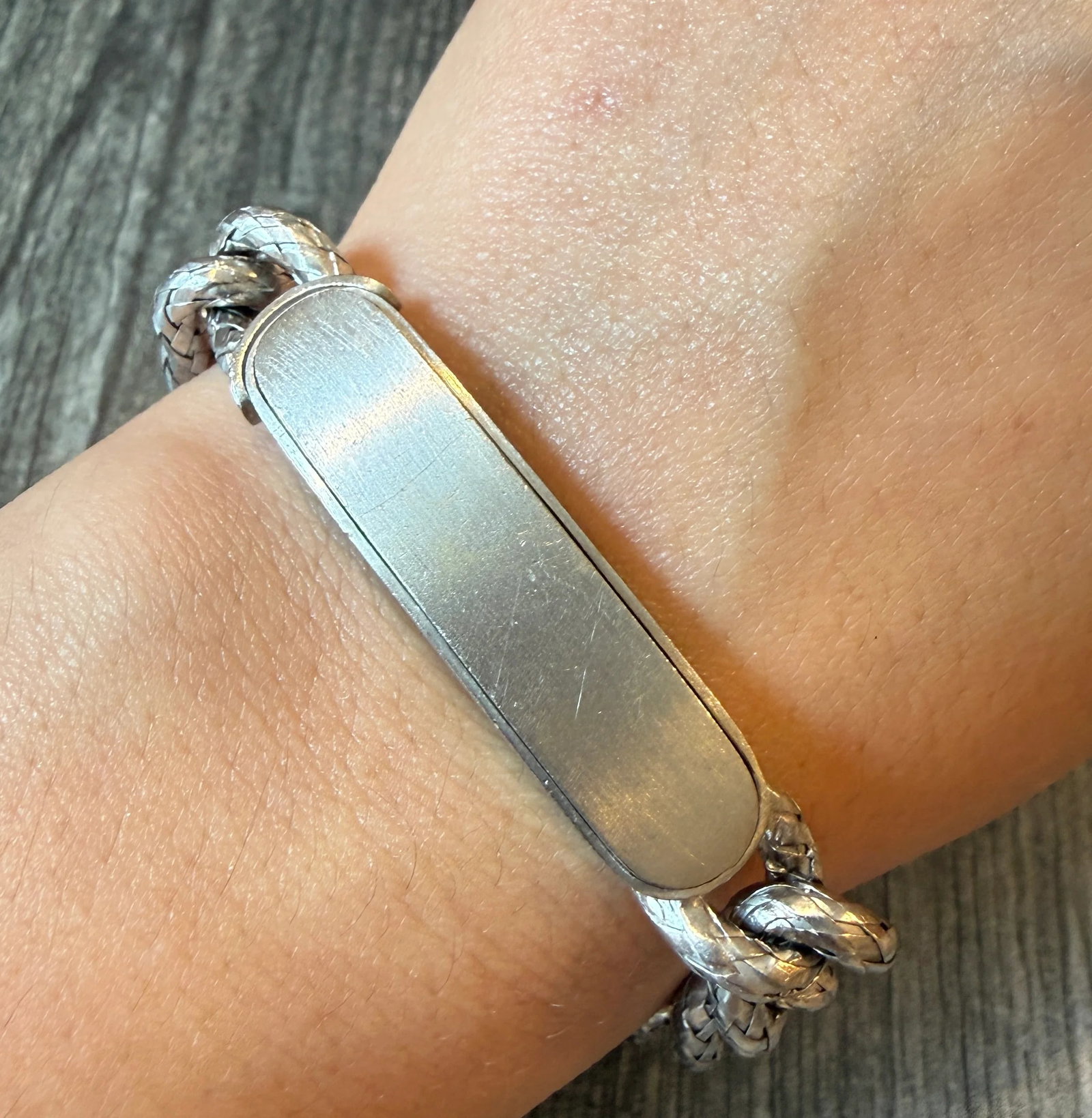 Bottega Veneta 18K White Gold ID Bracelet with Woven Curb Links, 7?? Long (I): Metal: 18K White Gold Weight: 57.4 grams Inner Circumference: 7 inches long by 10.8 mm wideMarkings: "750 BV”Condition: In very good condition with some minor surface wear.