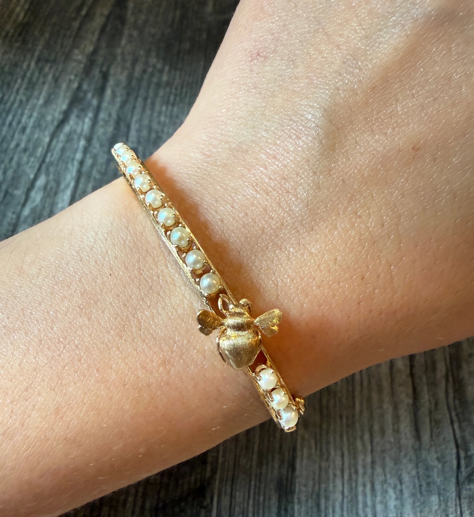 Vintage Bee Bangle Bracelet with Pearls in 14K Gold (I): Metal: 14K Yellow Gold Weight: 13 gramsInner Circumference: 6.25 inches Inner diameter: 1.8 inches long by 2.1 inches wide Markings: "14"Condition: In good condition with some minor surface wear.
