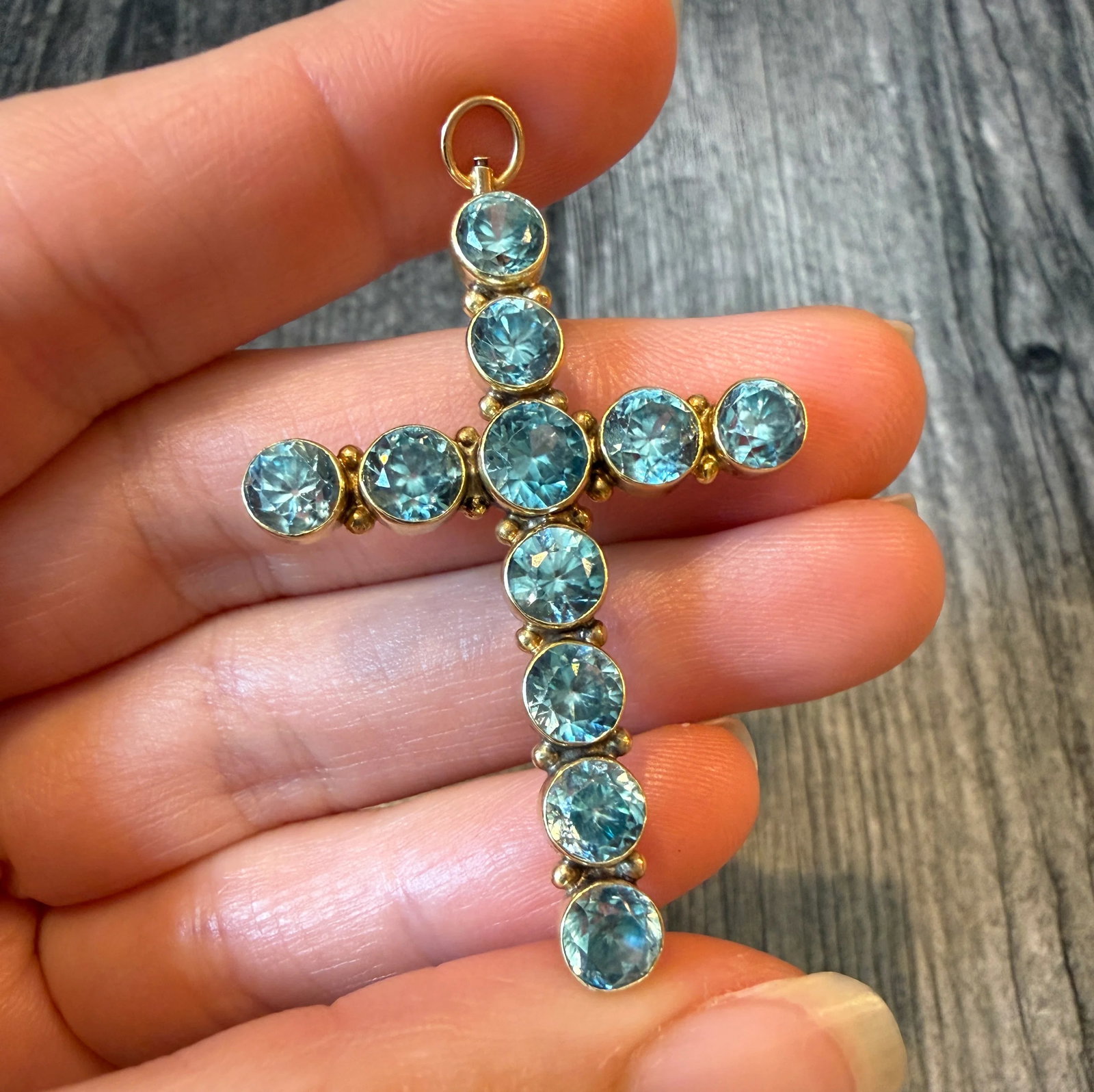 Large Blue Zircon Cross Pendant and Brooch in 14K Gold (S): Metal: 14K Yellow Gold (acid tested)Weight: 6.7 gramsMeasurement: 1.9 inches long by 1.3 inches wide Condition: In very good condition with some minor surface wear. Please note the chain in the photo 