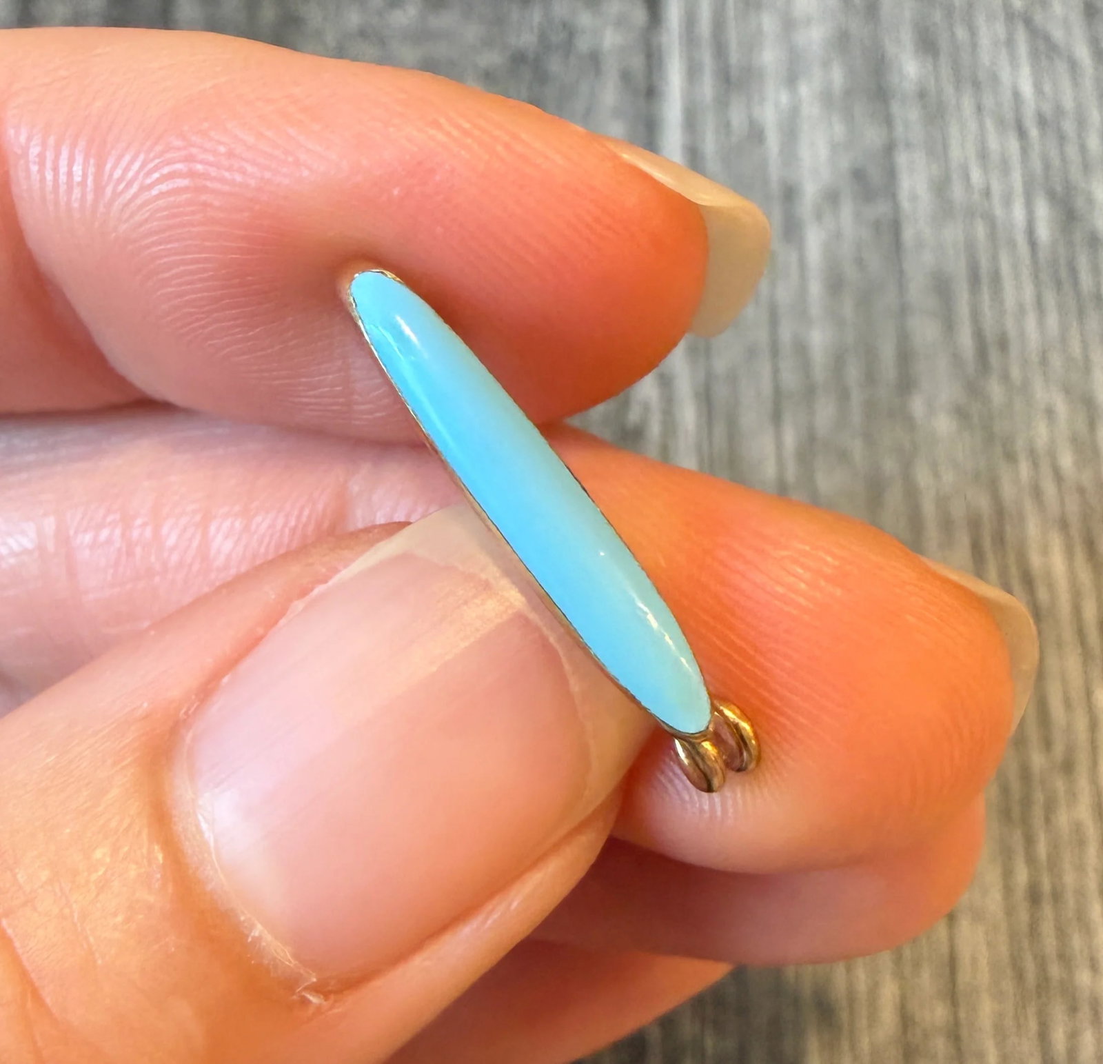 Small Antique Blue Enamel Safety Pin in 14K Gold: Metal: 14K Yellow Gold Weight: 1.3 gramsMeasurements: 0.25 inches long by 0.95 inches wideMarkings: "14K"Condition: In very good condition with some minor surface wear.