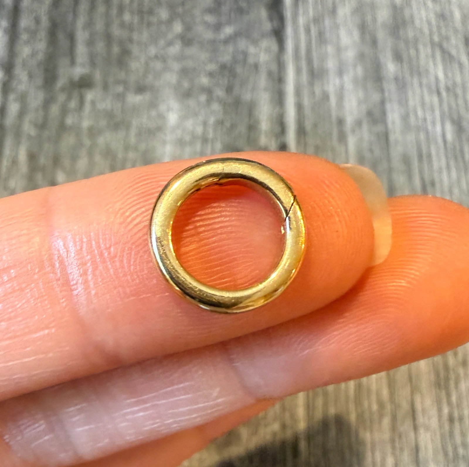Push In Connector in 14K Gold, Charm Holder or Chain Extender: Metal: 14K Yellow Gold Weight: 1.4 gramsMeasurements: 0.45 inches diameterWidth: 2.3 mm wide Markings: "14K"Condition: In very good condition with some minor surface wear.