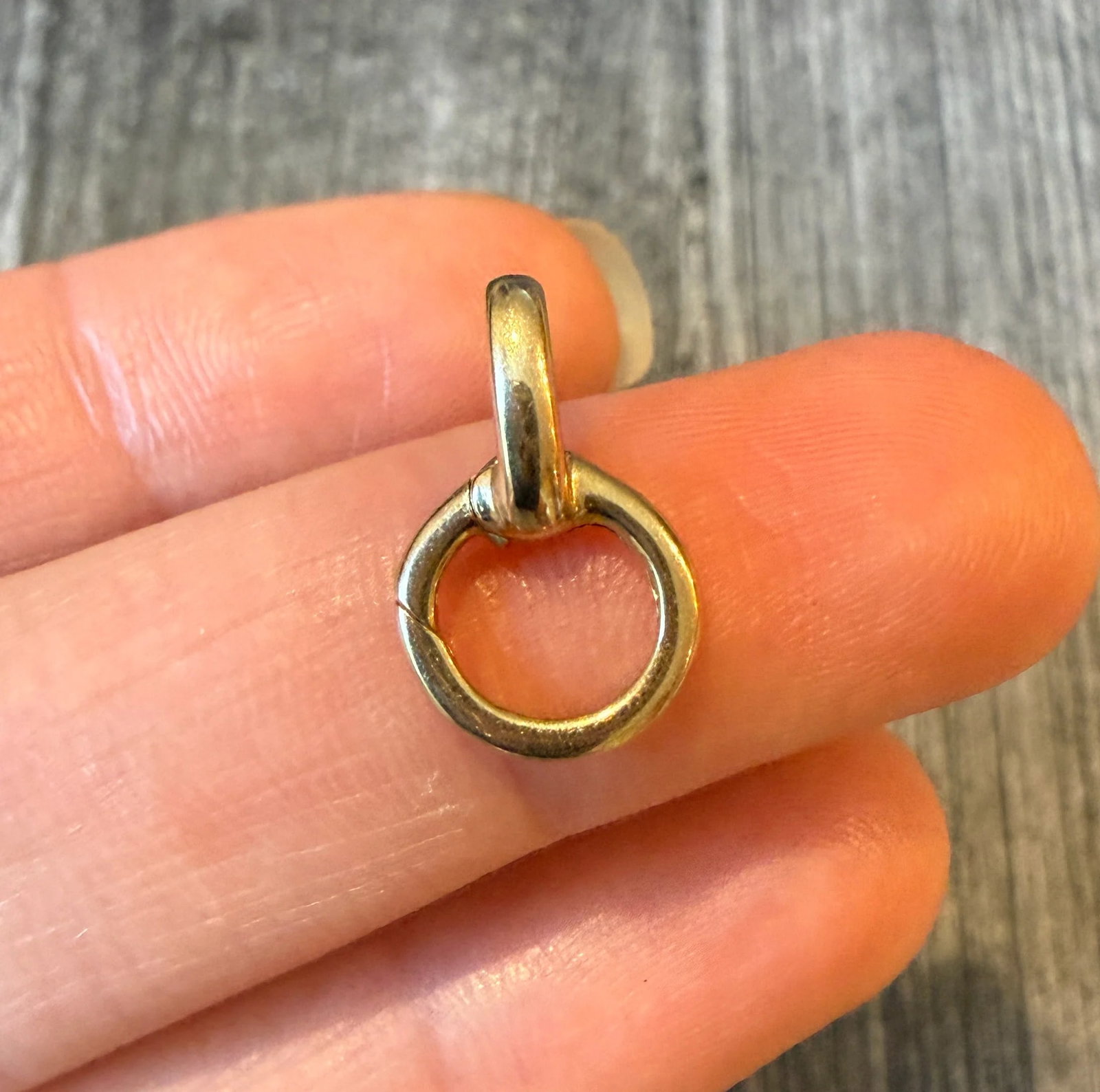 Push-In Charm Jumble Holder in 14K Gold: Metal: 14K Yellow Gold Weight: 1.6 gramsMeasurements: 0.65 inches long by 0.45 inches wideMarkings: "585"Condition: In very good condition with some minor surface wear.
