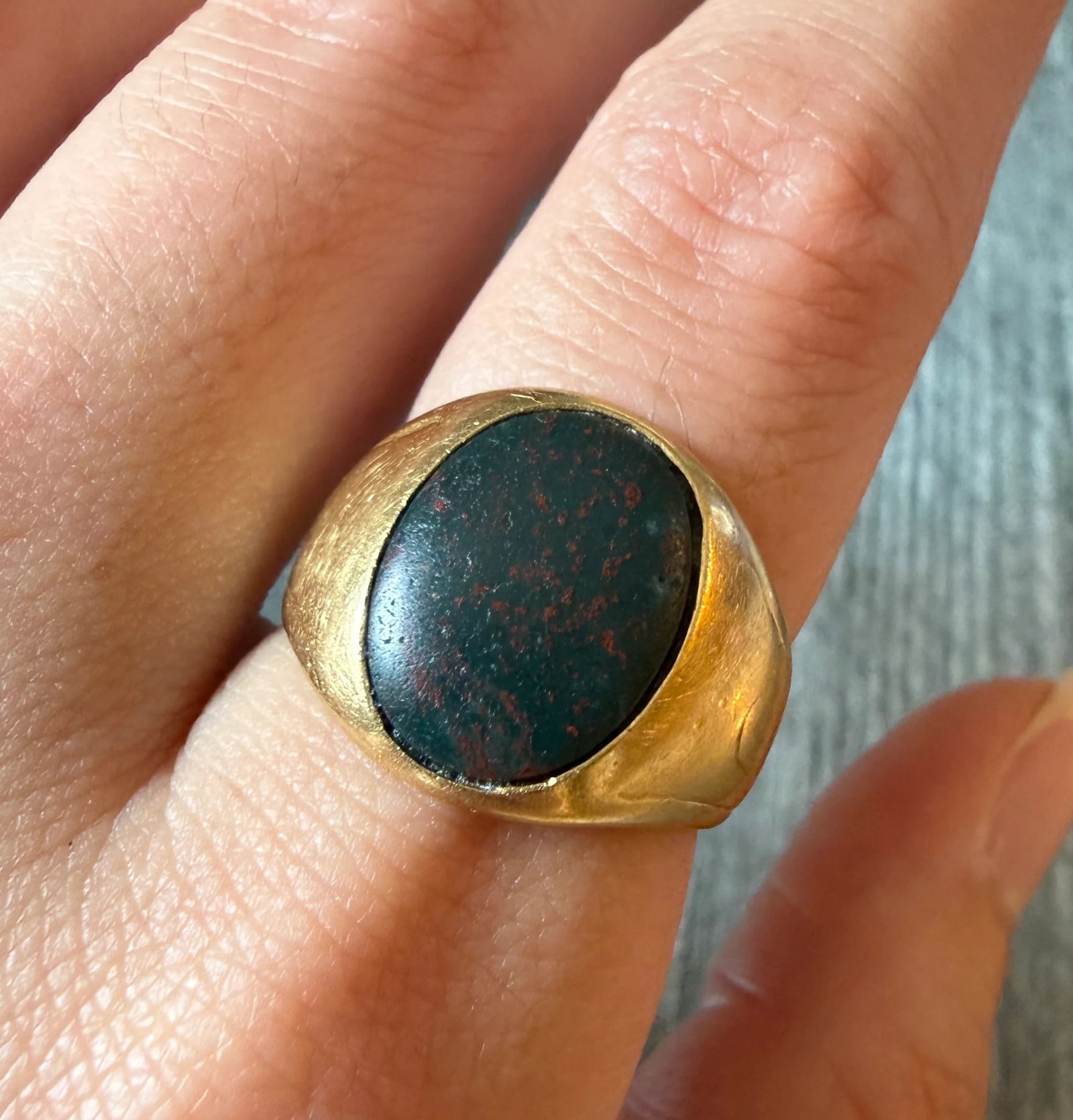 1940s Tiffany & Co Bloodstone Signet Ring in 18K Gold: Metal: 18K Yellow Gold Weight: 15.3 gramsRing Size: 7.5 on mandrel but fits slightly smaller due to width Inscription: "August 12, 1941” Markings: “TIFFANY & CO”Condition: In good condit
