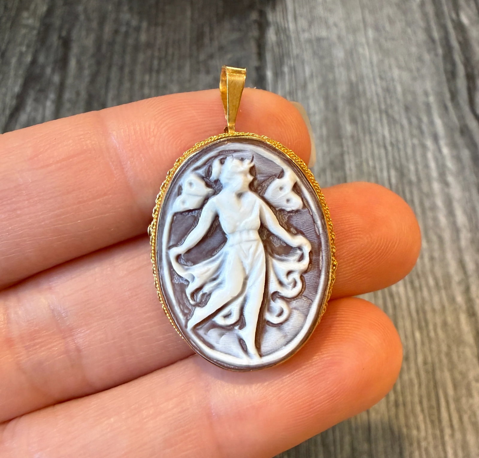 Handcarved Dancing Lady Shell Cameo Pendant and Brooch in 18K Gold: Metal: 18K Yellow Gold Weight: 4.5 gramsMeasurements: 1.2 inches long by 0.9 inches wideMarkings: "K18 ITALY" Condition: In very good condition with some minor surface wear.