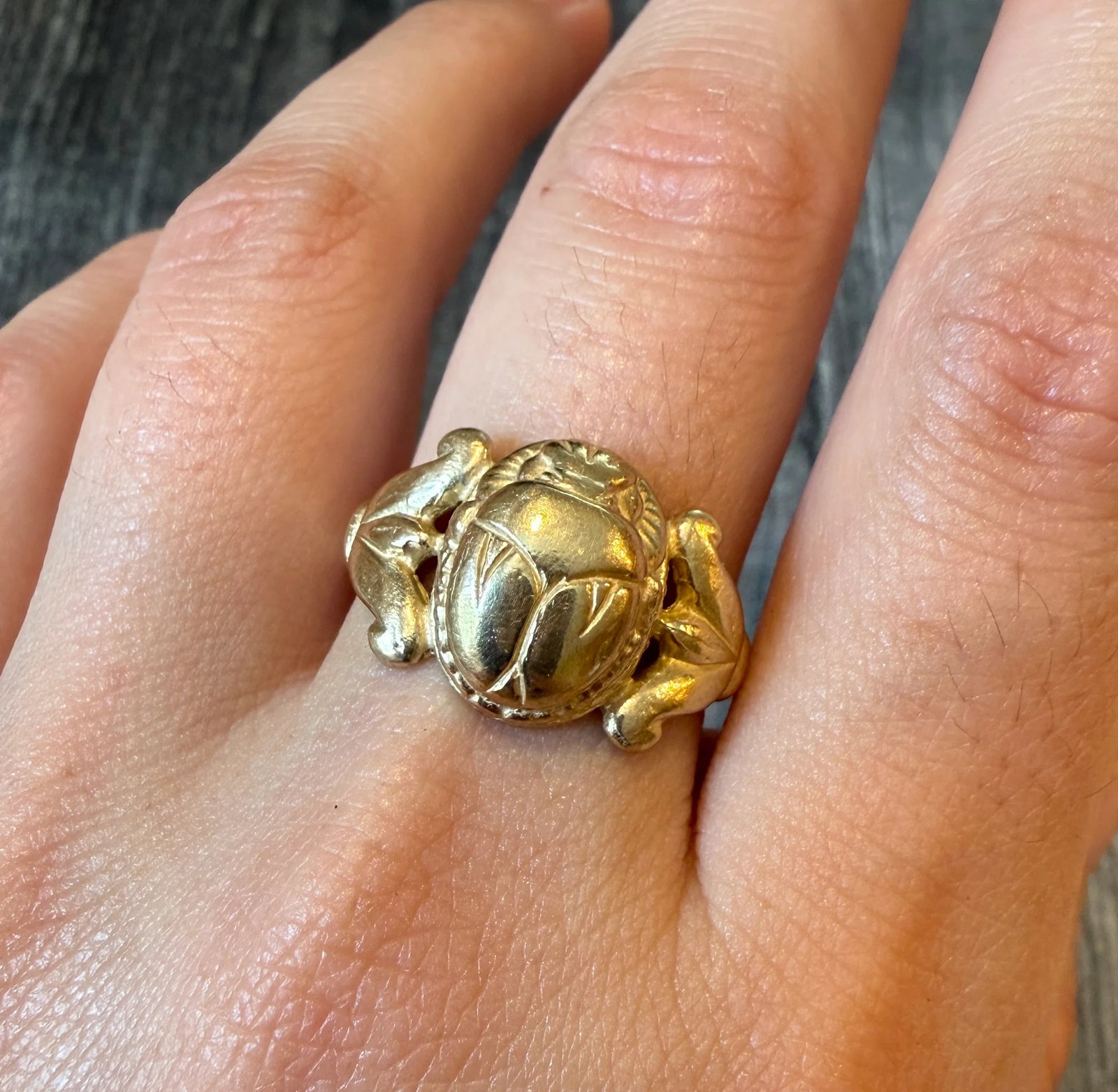 Vintage Egyptian Scarab and Lotus Ring in 10K Gold: Metal: 10K Yellow Gold Weight: 7.9 gramsRing Size: 9.5 (resizable)Markings: "10K"Condition: In very good condition with some minor surface wear.