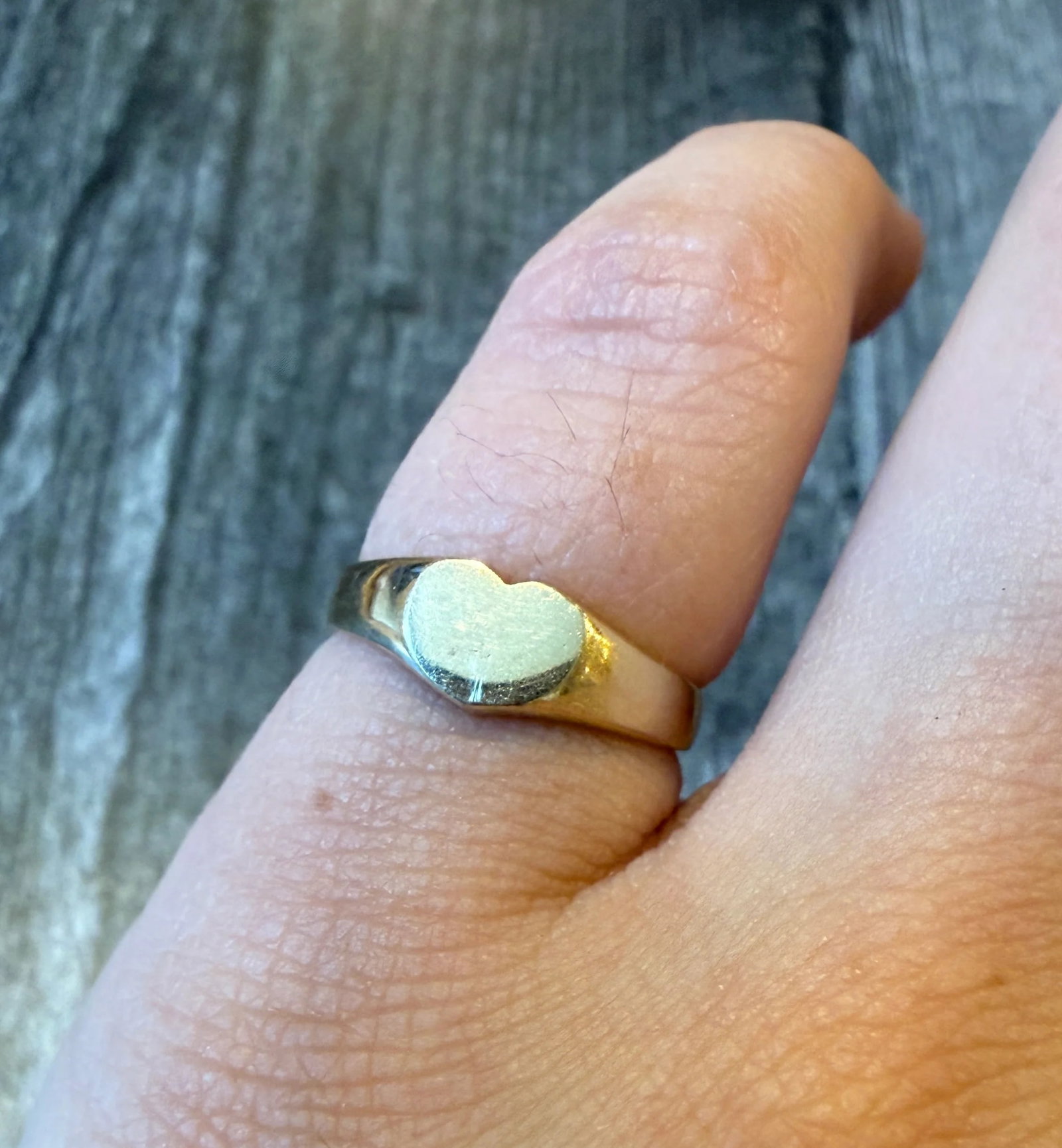 Small Heart Signet Ring in 14K Gold, Size 4.25: Metal: 14K Yellow Gold Weight: 2.2 gramsRing Size: 4.25 (slightly resizable)Width: 5.4 mm wide faceMarkings: "14K" Condition: In good condition with some minor surface wear.