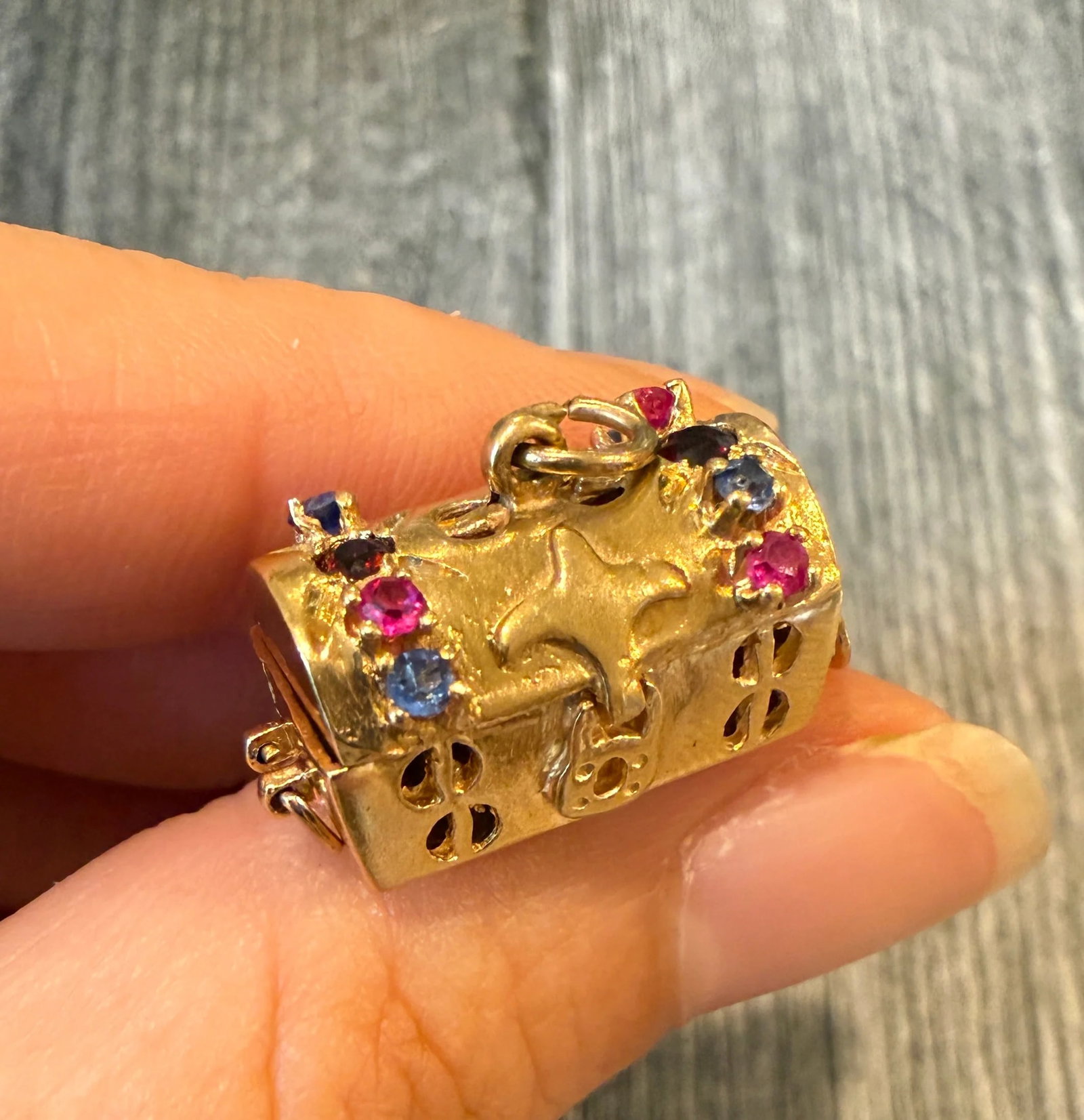 Movable Treasure Box Charm in 14K Gold: Metal: 14K Yellow Gold Weight: 7.3 gramsMeasurements: 0.5 inches long by 0.8 inches wideMarkings: “14K”Condition: In good condition with some minor surface wear.