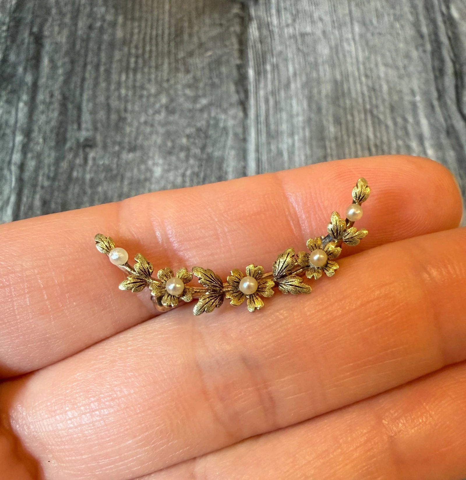 Art Nouveau Flower and Crescent Pin in 14K Gold: Metal: 14K Yellow Gold Weight: 2.4 grams Measurements: 1.4 inches long by 0.55 inches wideCondition: In good antique condition with some minor surface wear consistent with age. The pin clasp is a late