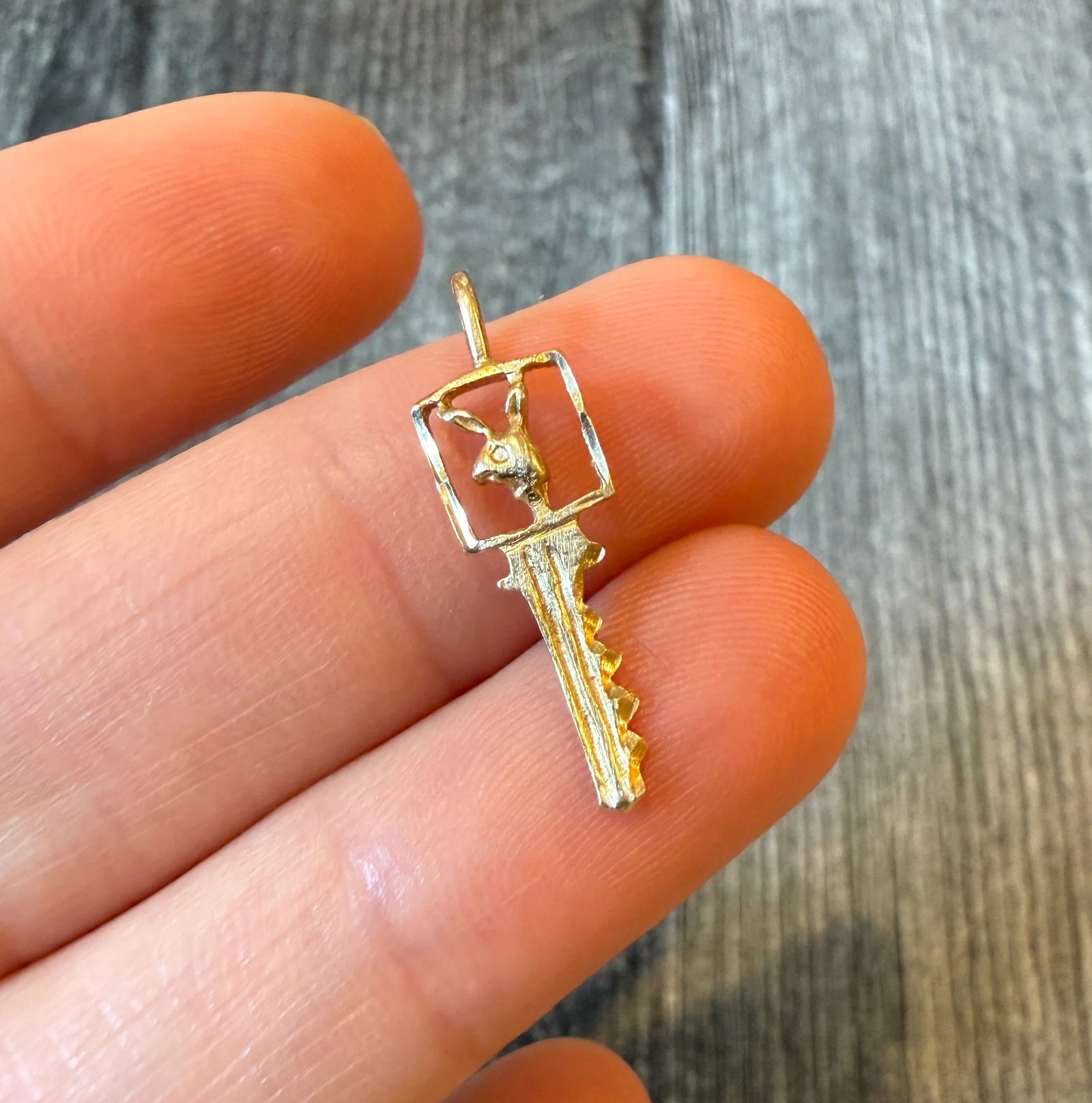 Small 14K Gold Playboy Key Charm: Metal: 14K Yellow Gold (acid tested)Weight: 0.7 gramsMeasurements: 0.8 inches long by 0.3 inches wideCondition: In good condition with some minor surface wear.