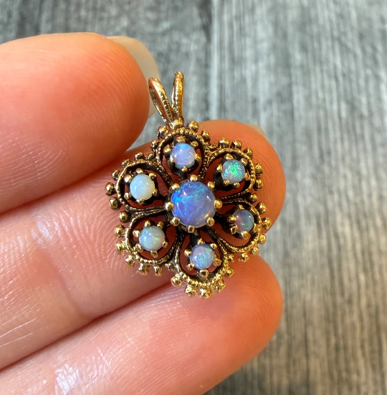 Vintage Opal Flower Etruscan Revival Style Charm in 14K Gold: Metal: 14K Yellow Gold Weight: 2.5 gramsMeasurements: 0.7 inches long by 0.7 inches wideCondition: In very good condition with some minor surface wear