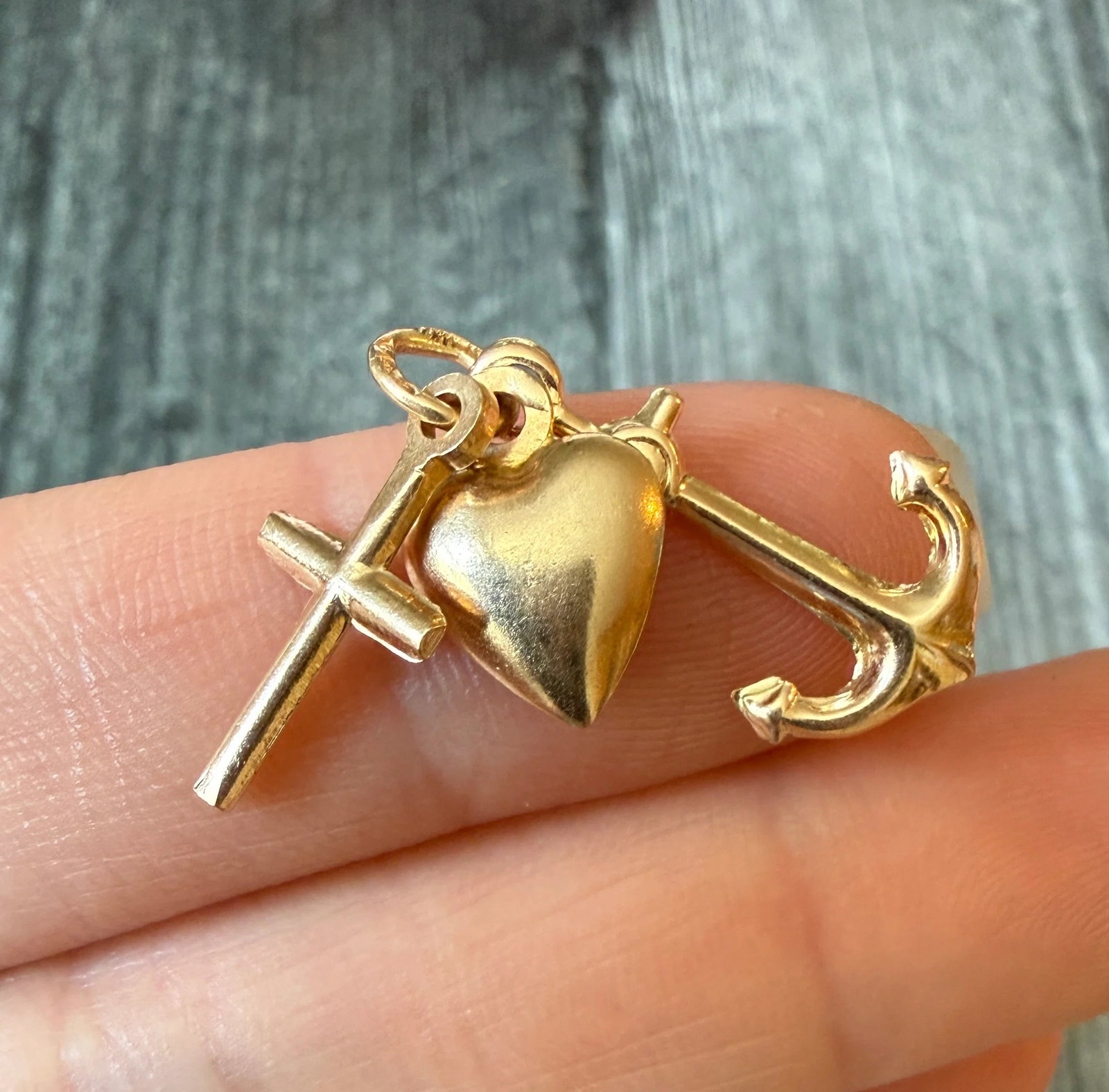 Faith, Hope and Love Charm in 14K Gold: Metal: 14K Yellow GoldWeight: 2.2 gramsMeasurements: 0.75 inches longMarkings: "14K ITALY"Condition: In very good condition with some minor surface wear