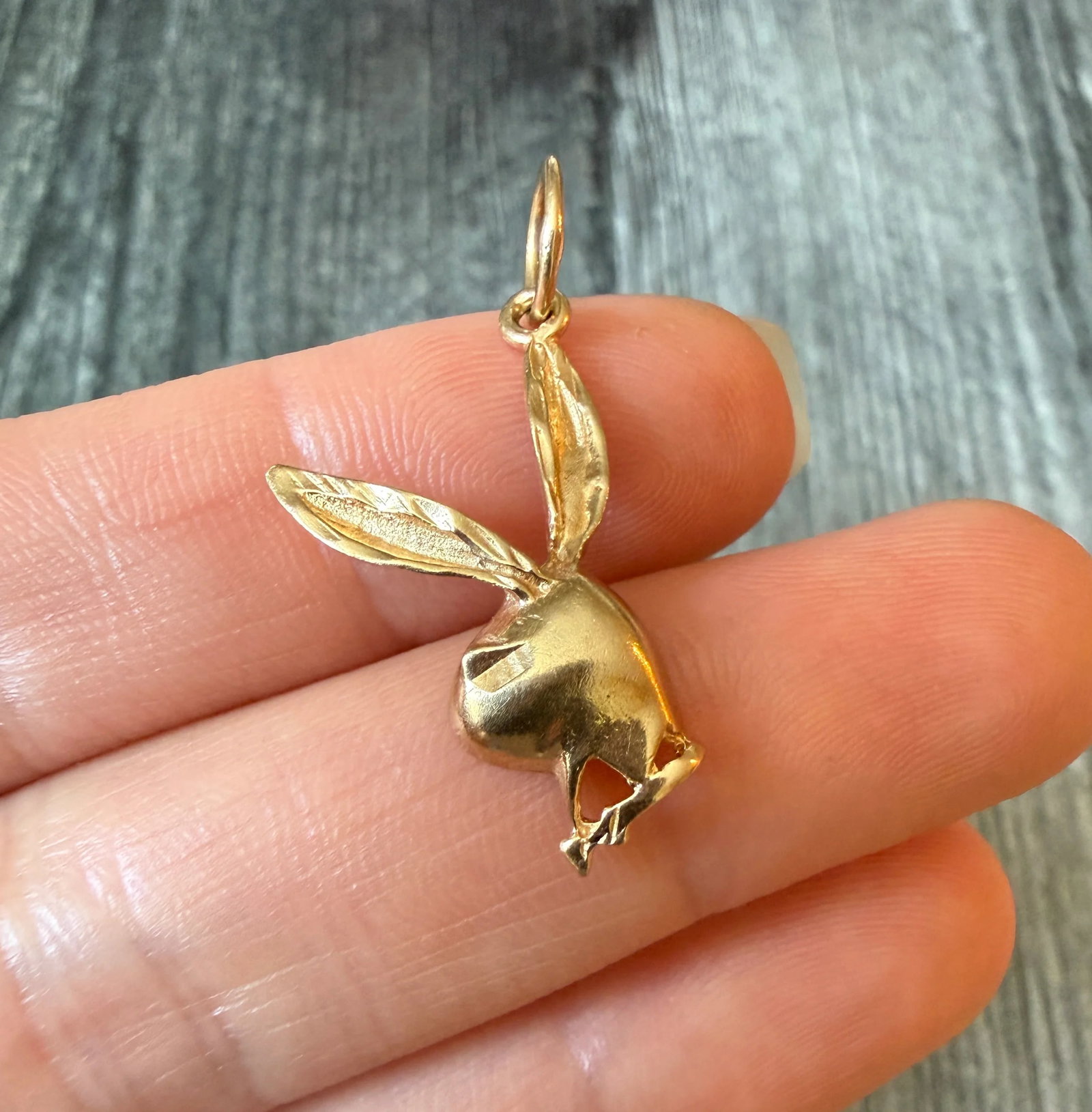 Playboy Bunny Charm in 14K Gold: Metal: 14K Yellow Gold (acid tested)Weight: 2.1 gramsMeasurements: 0.85 inches by 0.7 inches wideCondition: In good condition with some minor surface wear