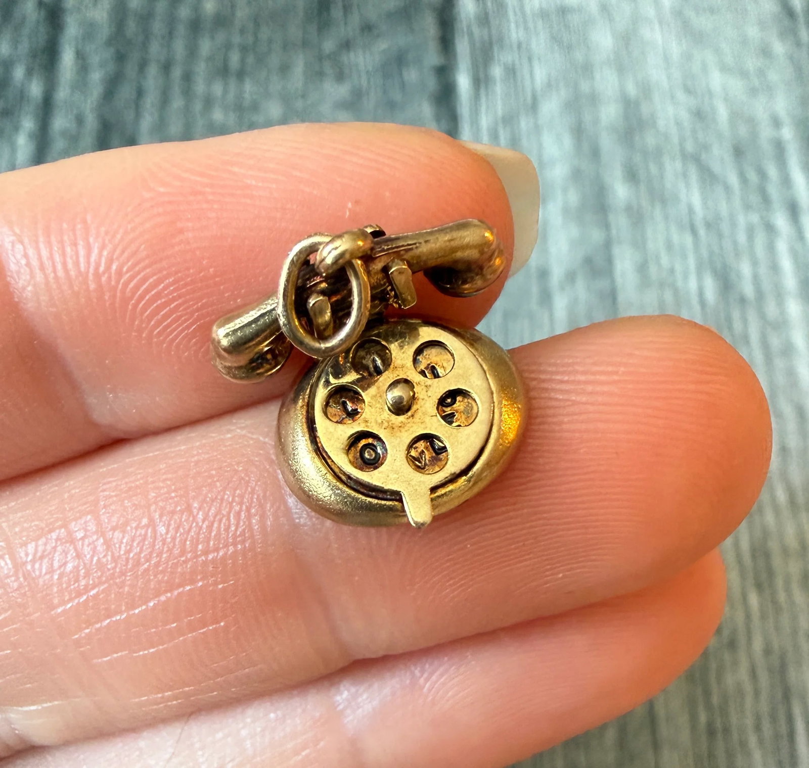 Movable "I LOVE U" Vintage Rotary Phone Charm in 14K Gold: Metal: 14K Yellow Gold Weight: 2.4 gramsMeasurements: 0.35 inches long by 0.55 inches wideMarkings: "14K JMF"Condition: In good vintage condition with some minor tarnish and surface wear consistent wi