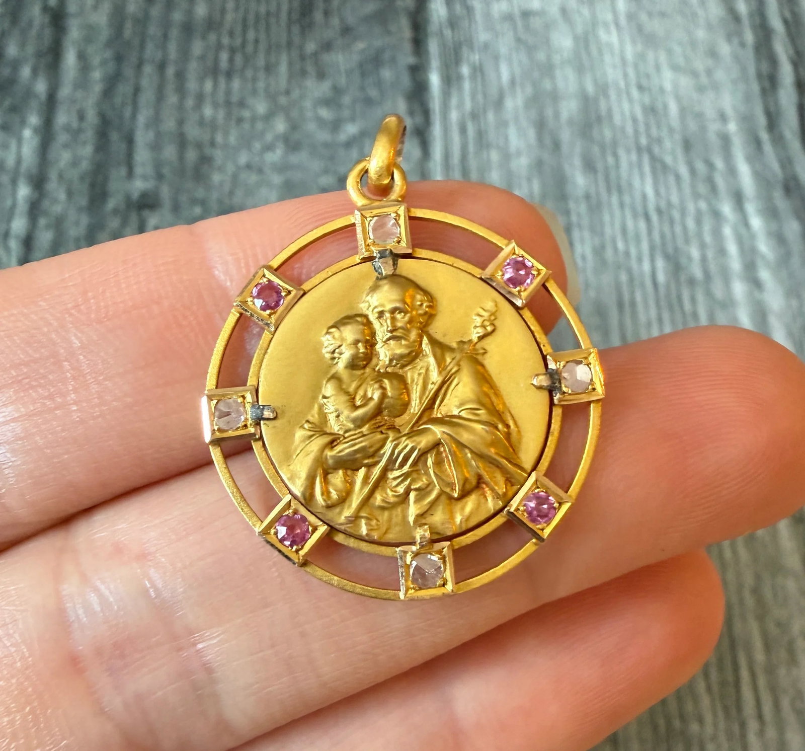Vintage St. Anthony Medal with Diamonds and Rubies in 18K Gold: Metal: 18K Yellow Gold Weight: 3 gramsMeasurements: 1 inch diameter Condition: In good condition with some lead solder near an old repair and some minor surface wear