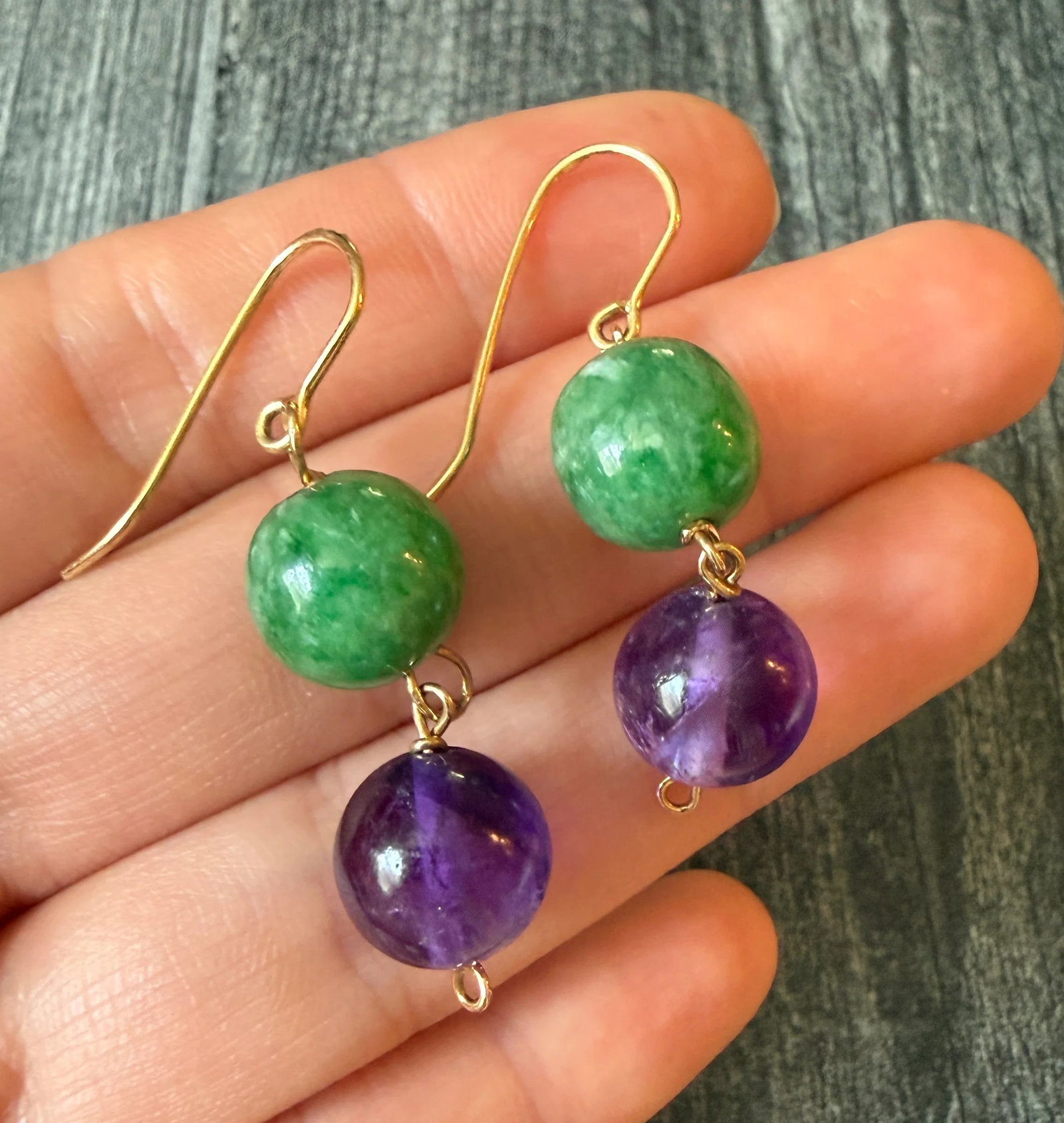 Jade and Amethyst Bead Dangling Earrings in 14K Gold (J): Metal: 14K Yellow Gold (acid tested)Weight: 11.1 gramsMeasurements: 1.75 inches longCondition: In very good condition with some minor surface wear