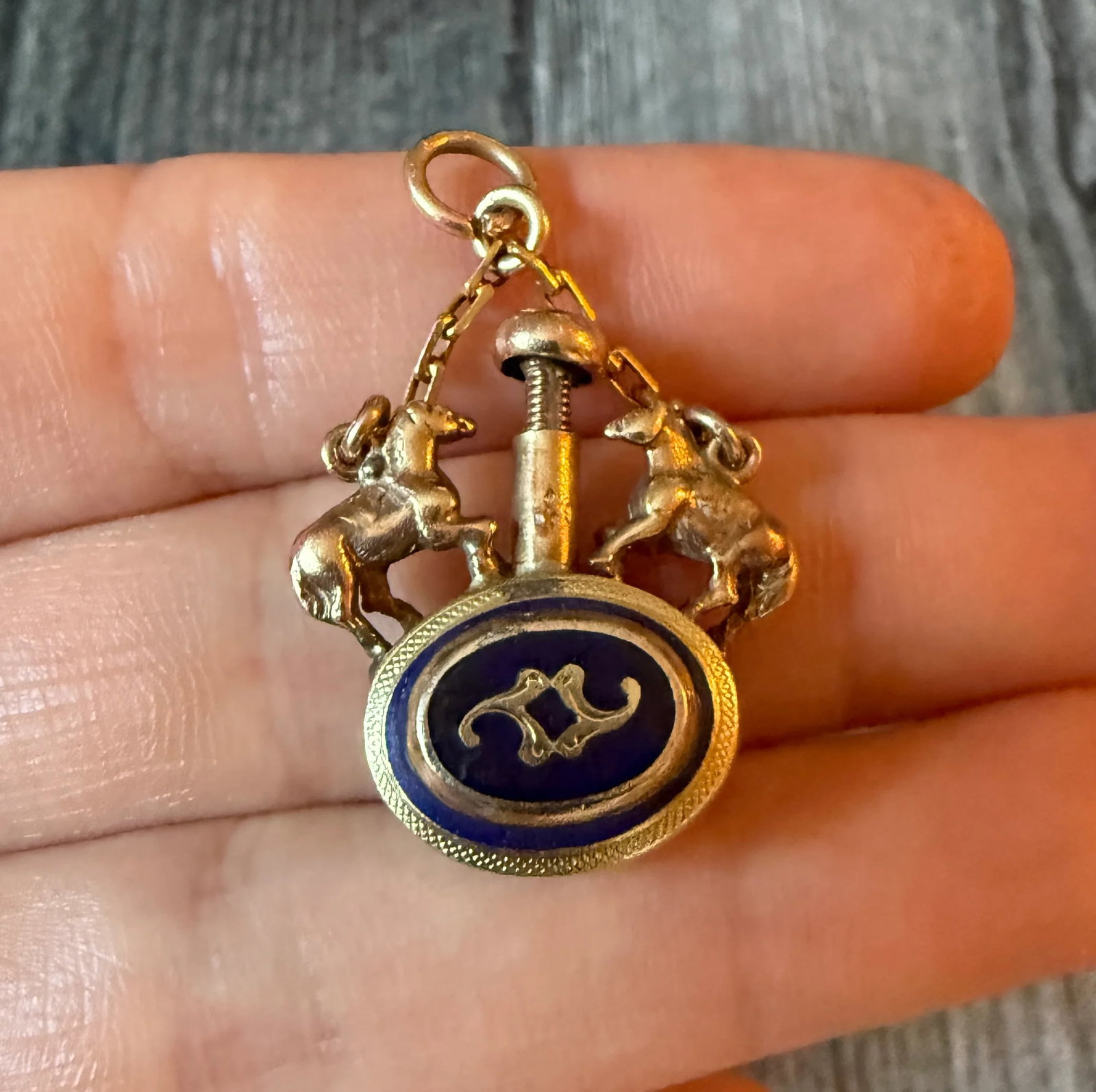 Antique Scent Bottle Pendant with a Horse Motif in 14K Gold: Metal: 14K Yellow Gold Weight: 9.7 gramsMeasurements: 1 inch long (not including the chain) by 0.9 inches wideCondition: In good antique condition with some minor surface wear consistent with age