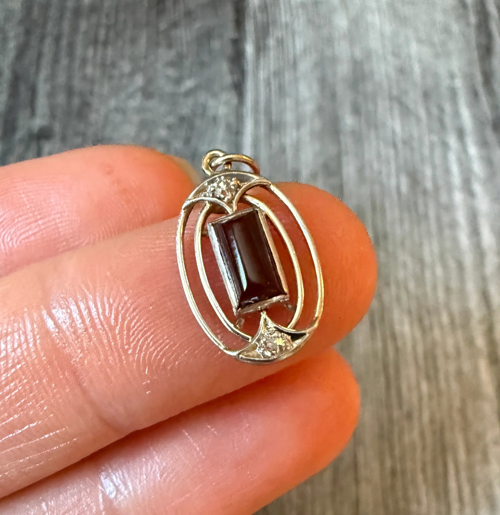 Carnelian and Diamond Oval Openwork Charm in 14K Gold m: Metal: 14K White Gold (acid tested)Weight: 1.6 gramsMeasurements: 0.55 inches long by 0.45 inches wideCondition: In good condition with some minor surface wear. Likely a stickpin conversion.