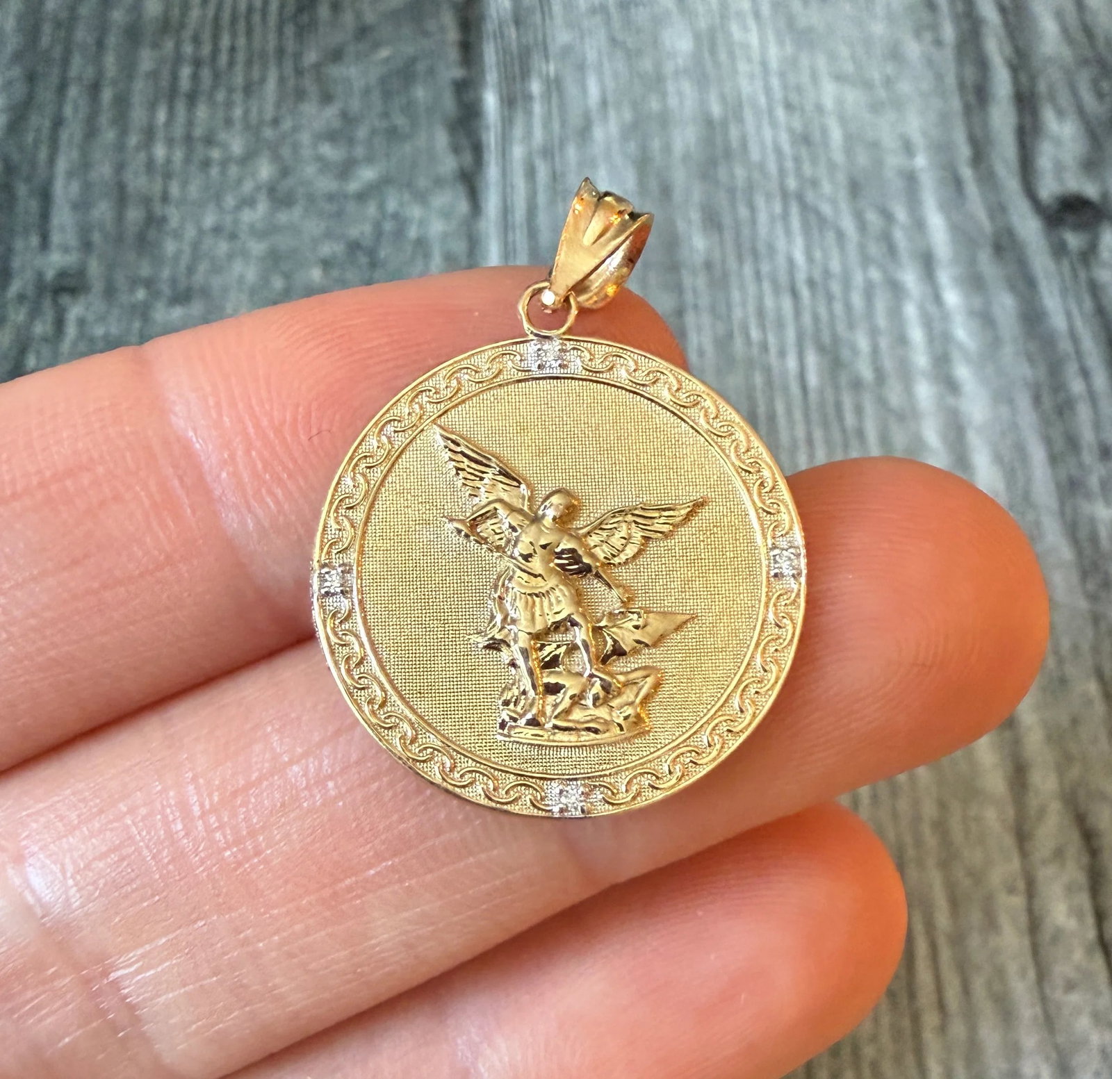 Saint Michael Medal in 14K Gold with Diamonds: Metal: 14K Yellow GoldWeight: 3.1 gramsMeasurements: 0.9 inch diameter Markings: "14K”Condition: In good condition with some minor surface wear