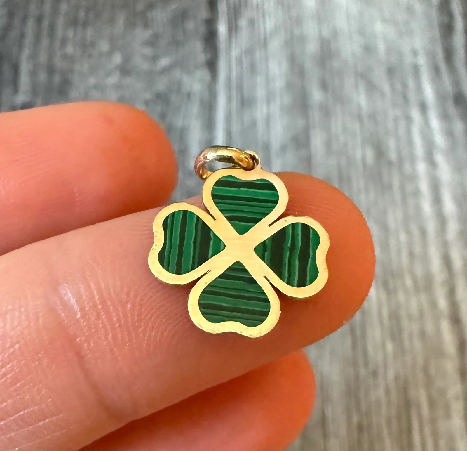 Inlaid Malachite and 14K Gold Clover Charm: Metal: 14K Yellow Gold Weight: 0.7 gramsMeasurements: 0.55 inches long by 0.55 inches wideMarkings: "14K"Condition: In very good condition with some minor surface wear. Please keep in mind that these