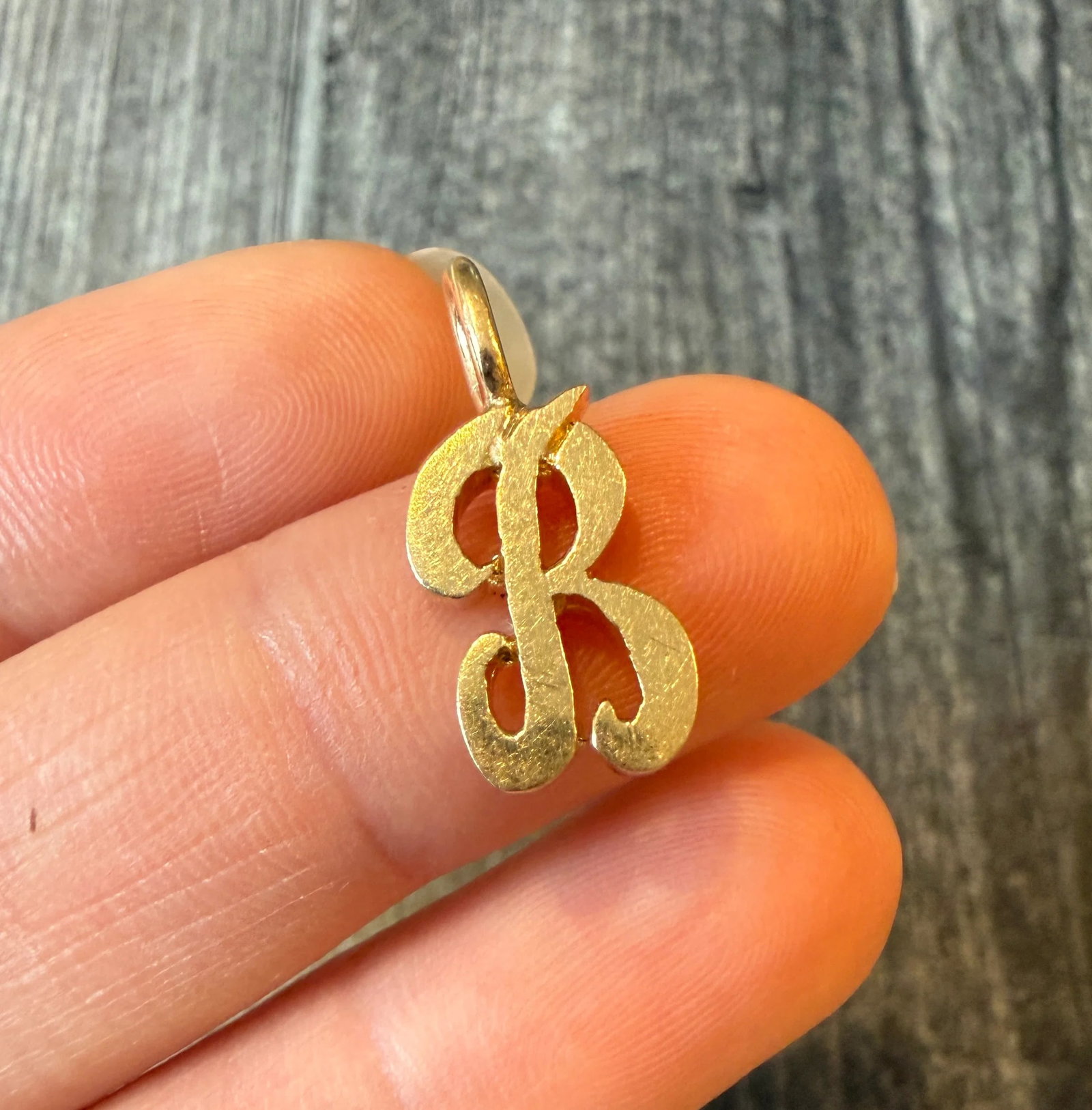 Dimensional 14K Gold Initial "B" Charm: Metal: 14K Yellow Gold Weight: 2.9 gramsMeasurements: 0.55 inches long by 0.4 inches wideMarkings: "14K RJ"Condition: In very good condition with some minor surface wear