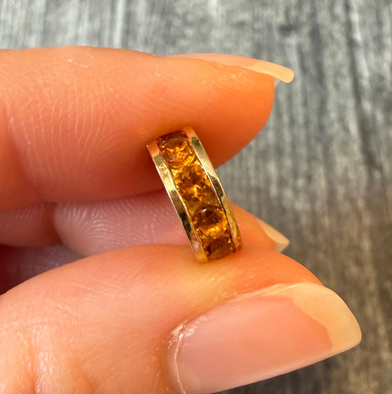 Citrine and 14K Gold Rondelle Charm: Metal: 14K Yellow Gold (acid tested)Weight: 2.4 gramsCitrine: Approximately 0.66 caratsMeasurements: 0.5” by 4.2 mm wideInner diameter of the hole for chain: 6.4 mm diameter Condition: In very