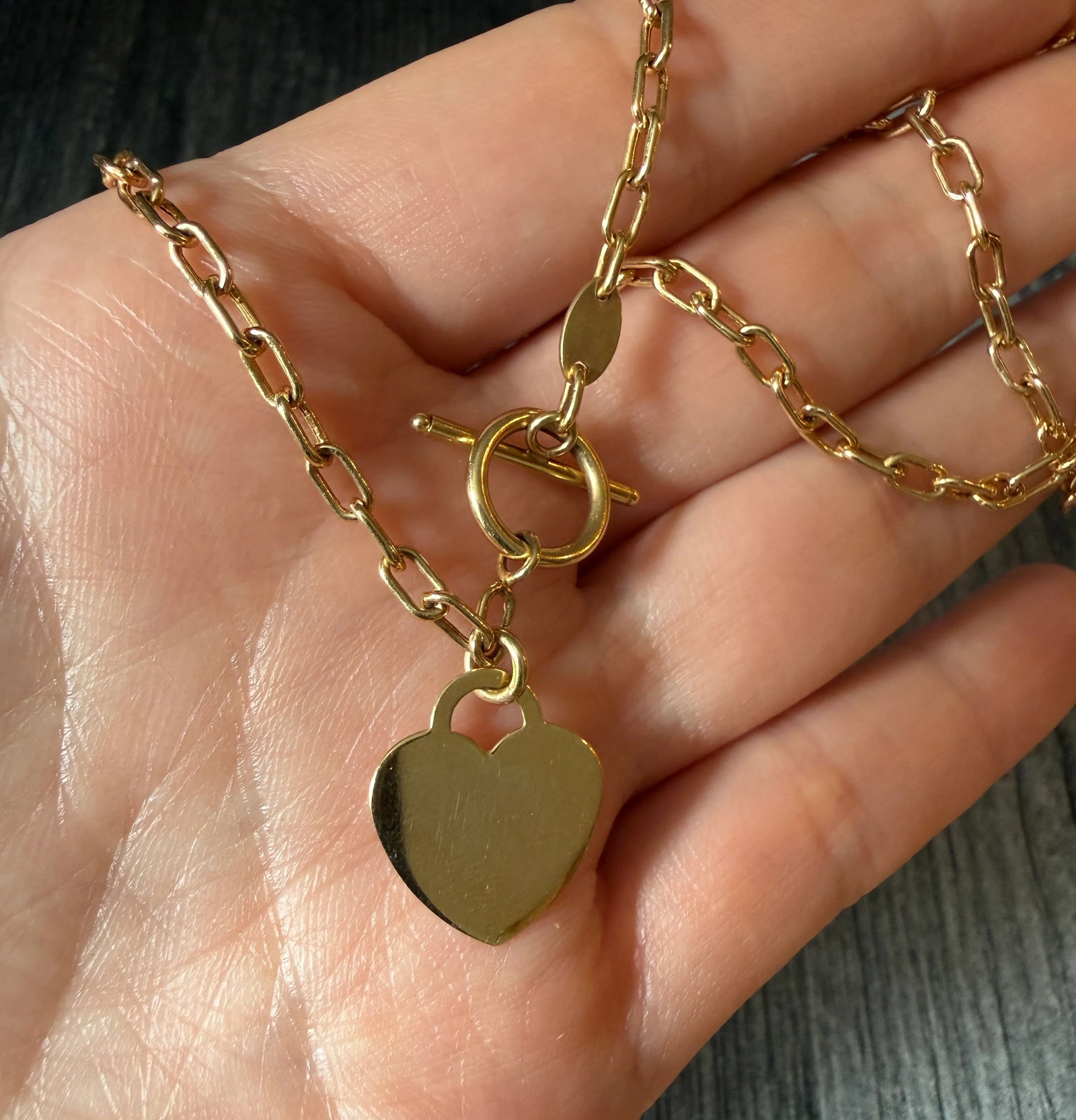 Toggle Oval Link Chain with a Heart Tag Charm, 16.75?? Long: Metal: 14K Yellow Gold Weight: 5 gramsMeasurements: 16.75 inches long by 3 mm wide linksMarkings: "RCI 14K"Condition: In good condition with some minor surface wear