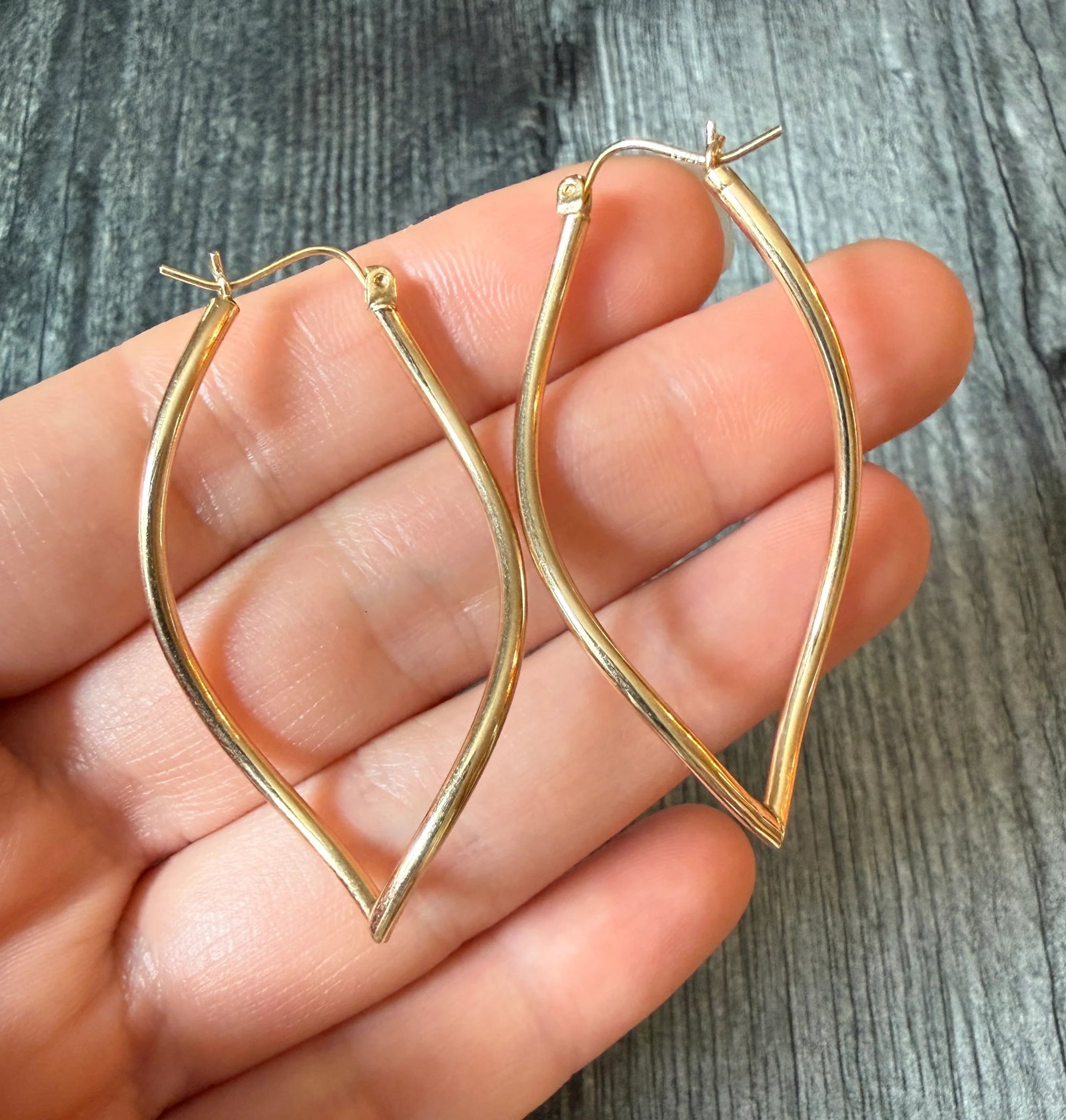 Large Wavy Leaf Shaped Tubular Hoop Earrings in 14K Gold: Metal: 14K Yellow GoldWeight: 2.8 gramsMeasurements: 2 inches longMarkings: "14K"Condition: In good condition with some minor surface wear