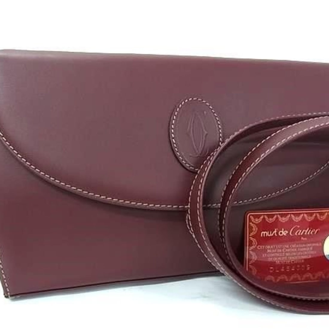 Cartier clutch bag, Must line, Bordeaux leather, women's shoulder bag: --- Catalog ---Category: SizeSize (HxWxD): 15.5cm x 24.5cm x 3.5cm / 6.1'' x 9.64'' x 1.37''Category: DesignType: Clutch bag, Shoulder bagColor: BordeauxGender: WomenMaterial: Leather Category: Genera