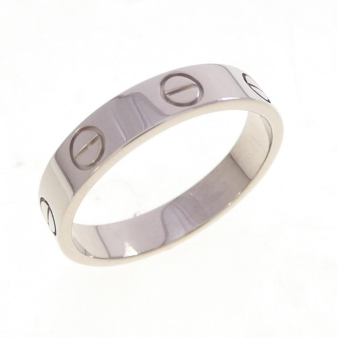 Cartier Mini Love Ring: --- Catalog ---Category: SizeUS Size: 6Brand Size: 51Category: DesignType: Band ringGender: WomenMaterial: White gold (18K)Category: GeneralBrand: Cartier--- Item List ---Section: ConditionRanking: Ra