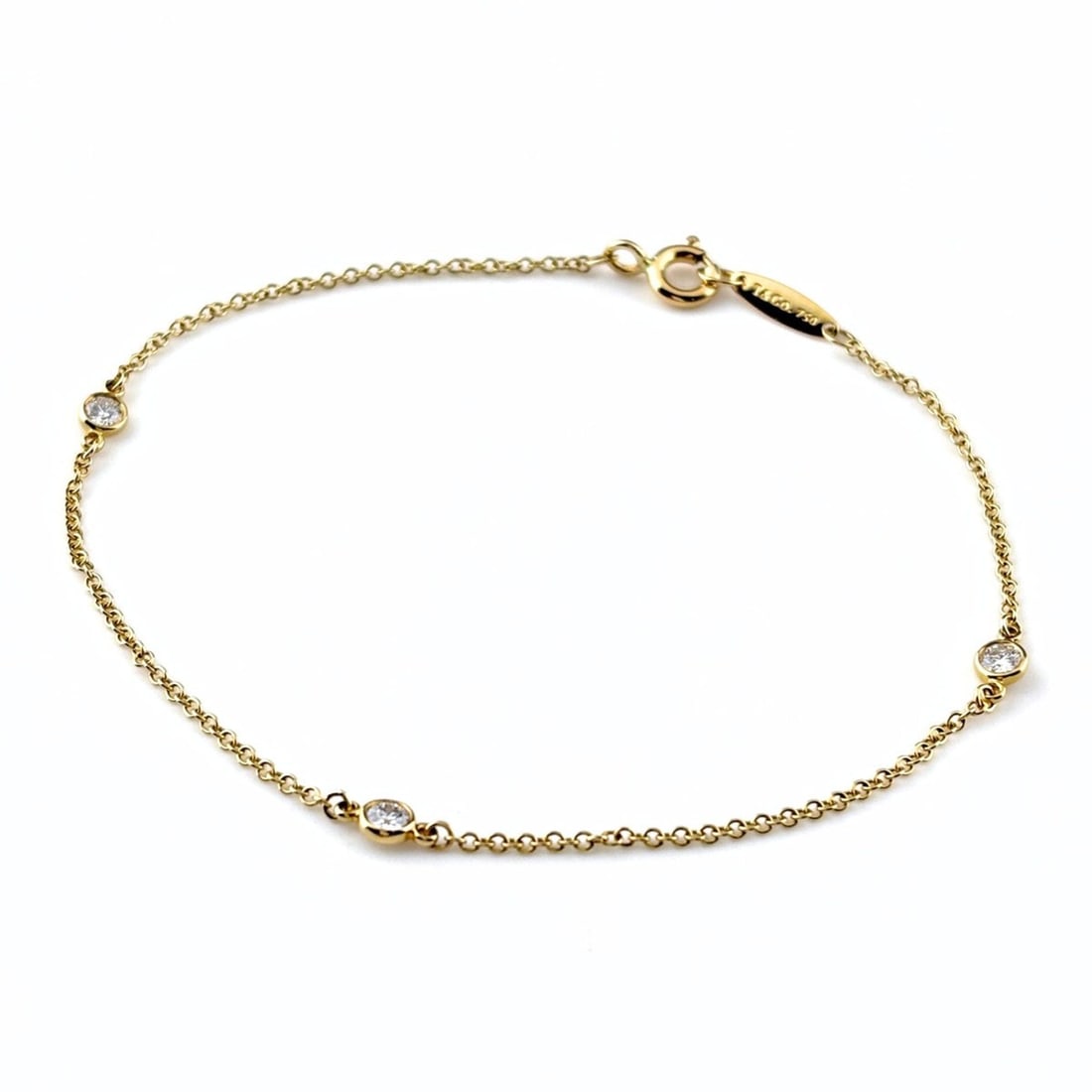 Tiffany & Co. By the Yard Yellow Gold Bracelet with Small Diamonds (750 Diamond) - Women's: --- Catalog ---Category: SizeLength: 17cm / 6.69''Category: DesignType: Charm braceletStone: DiamondGender: WomenMaterial: Yellow gold (18K)Category: GeneralBrand: Tiffany--- Item List ---Section: Con