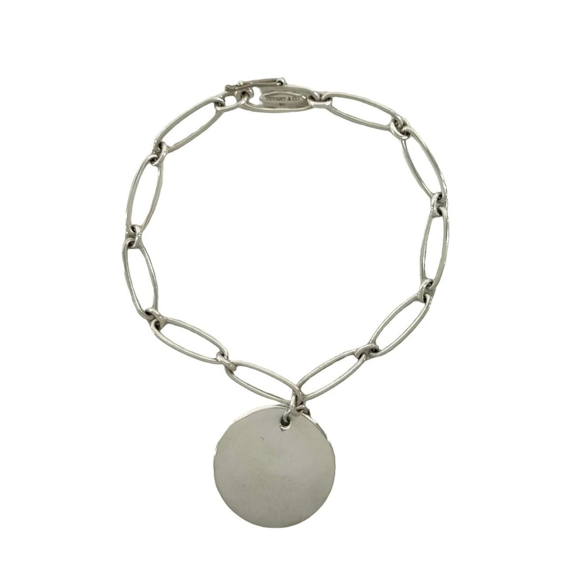 TIFFANY&Co. Tiffany Vintage Elsa Peretti Round Tag Bracelet, Sterling Silver 925, Accessory, 98089: --- Catalog ---Category: SizeLength: 17cm / 6.69''Category: DesignType: Charm braceletColor: SilverGender: WomenMaterial: Silver 925Category: GeneralBrand: Tiffany--- Item List ---Section: ConditionRa