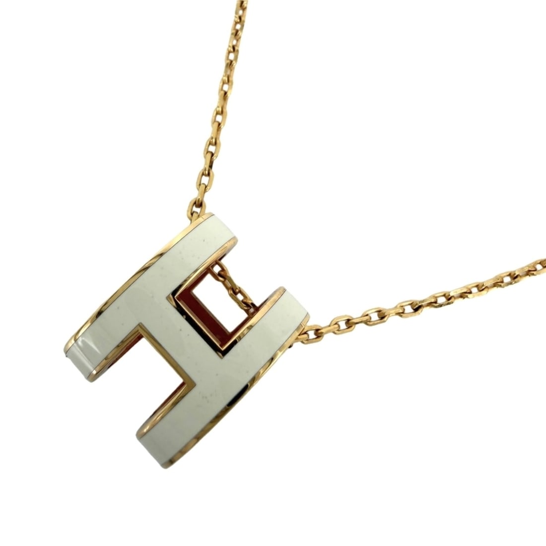 Hermes women's Pop H necklace, adjustable clasp, white and gold, approximately 4.9g.: --- Catalog ---Category: SizeWidth: 1mm / 0.04''Weight: 4.9g / 0.17oz.Pendant Size: 15mm x 12mm / 0.59'' x 0.47''Neck Circumference: 40 cm / 15.74''Category: DesignColor: Gold, WhiteGender: WomenNeckl