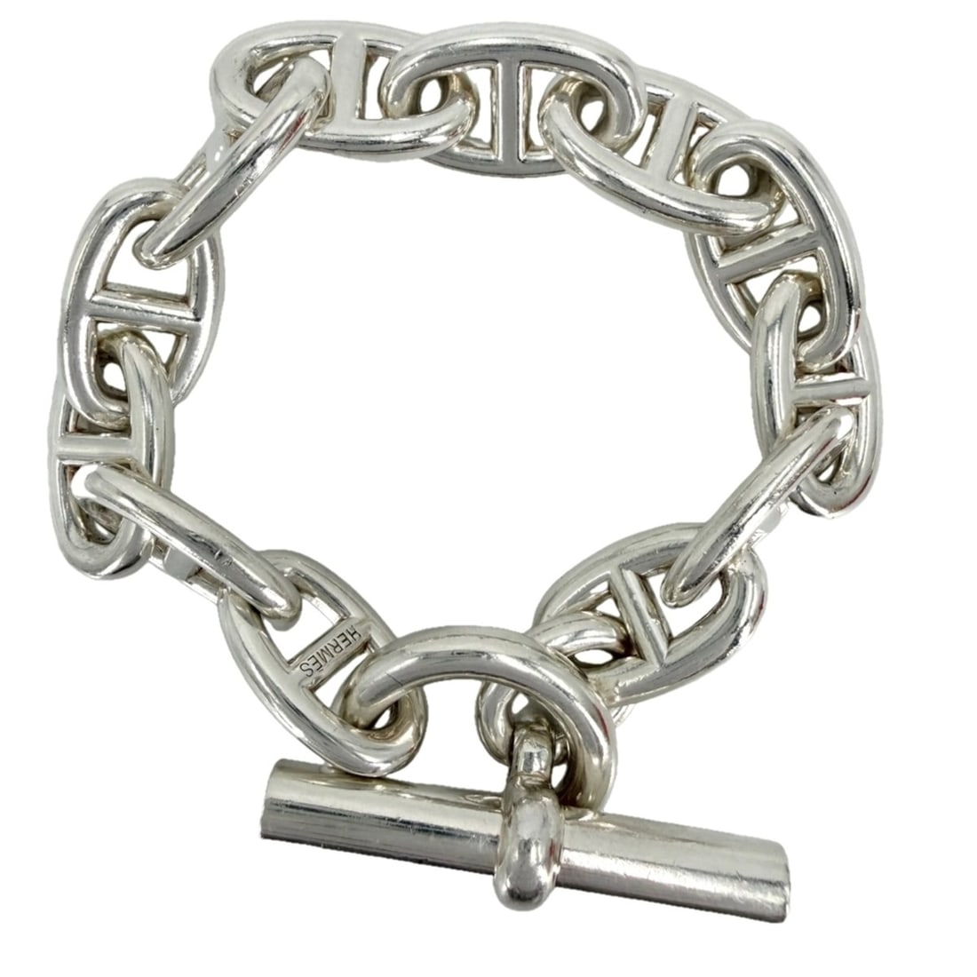 Hermes Chaine d'Ancre TGM bracelet for men, 12 links, sterling silver (925), approximately 112.5g.: --- Catalog ---Category: SizeLength: 18cm / 7.08''Category: DesignType: Charm braceletColor: WhiteGender: MenMaterial: Silver 925Category: GeneralBrand: Hermes--- Item List ---Section: ConditionRankin
