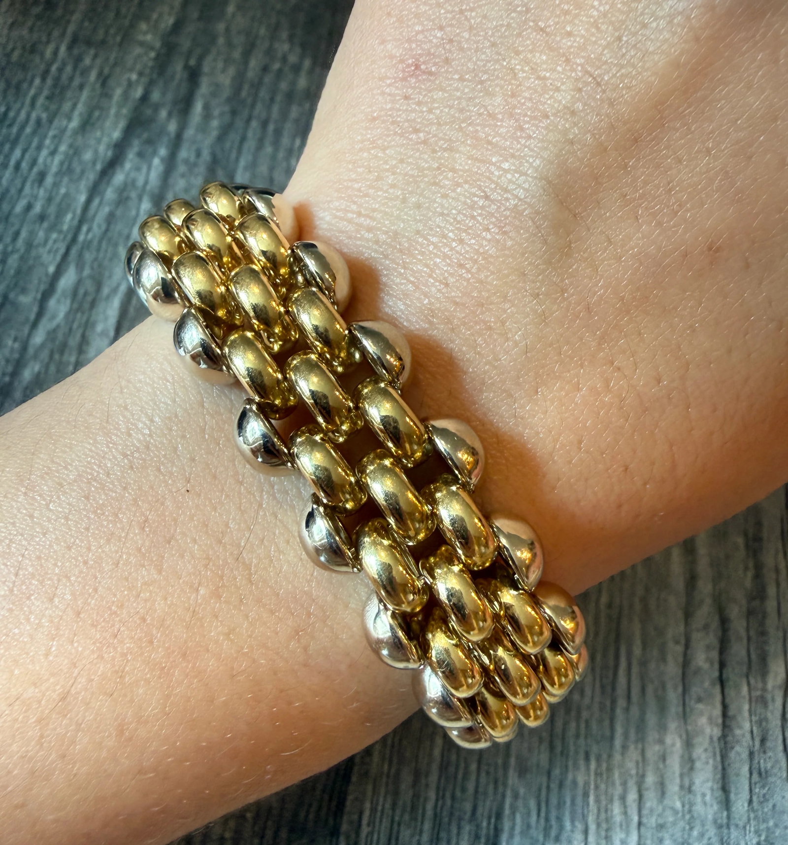 Vintage 18K Bicolor Gold Wide Circular Link Bracelet, (I): Metal: 18K Yellow and White Gold Weight: 60.8 grams Measurements: 7.5 inches long (fits like a 6.75” length due to design) by 18.2 mm wide"Markings: "ITALY 750"Condition: In very good condition 