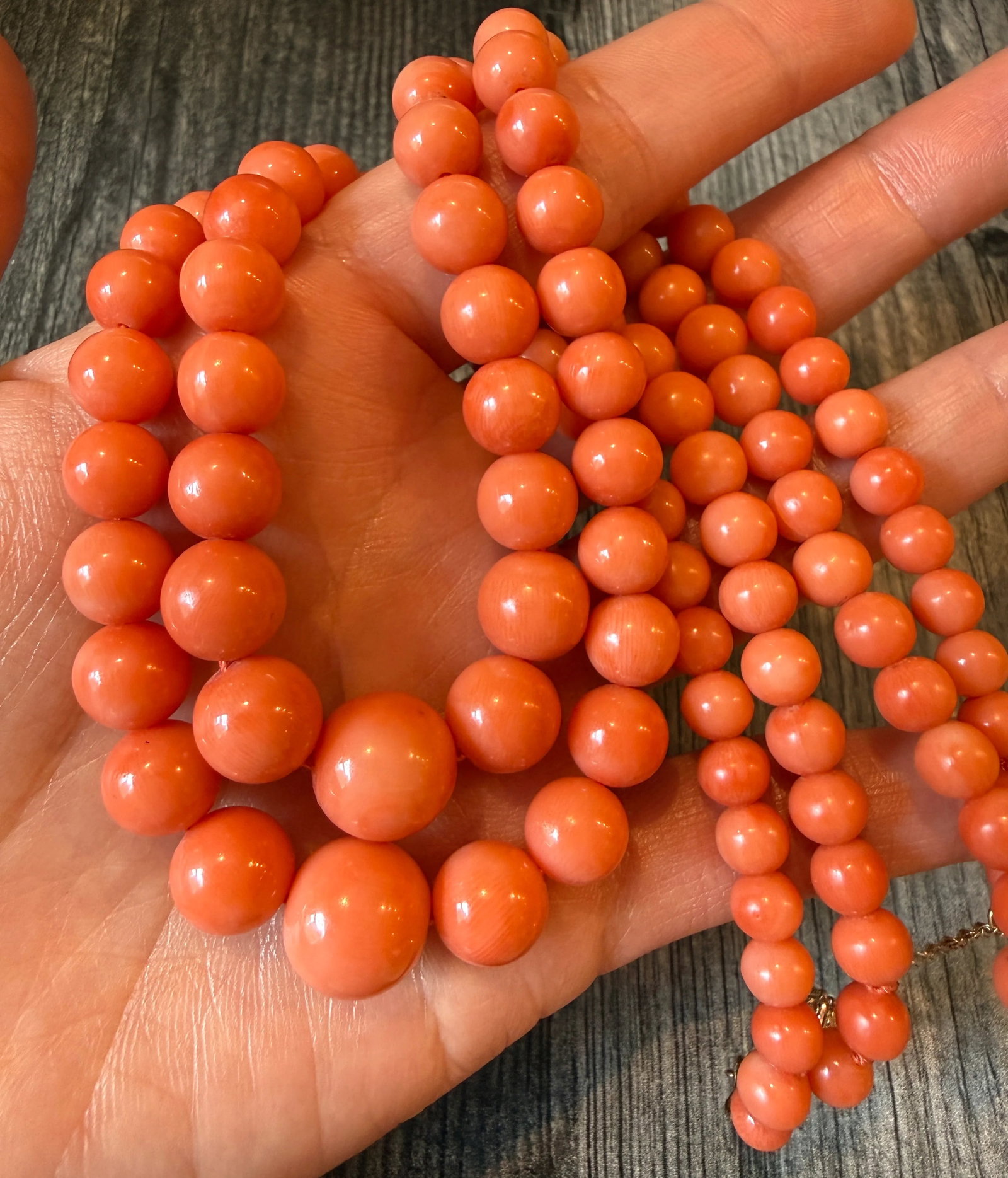 Graduated Coral Bead Multistrand Necklace (I): Metal: 14K Yellow Gold ClaspWeight: 79.8 gramsShortest Strand Length: 16 inches long Coral: Ranges from 6.7 mm to 12.9 mm wideMarkings: "14KTCondition: In very good condition with some minor surface w