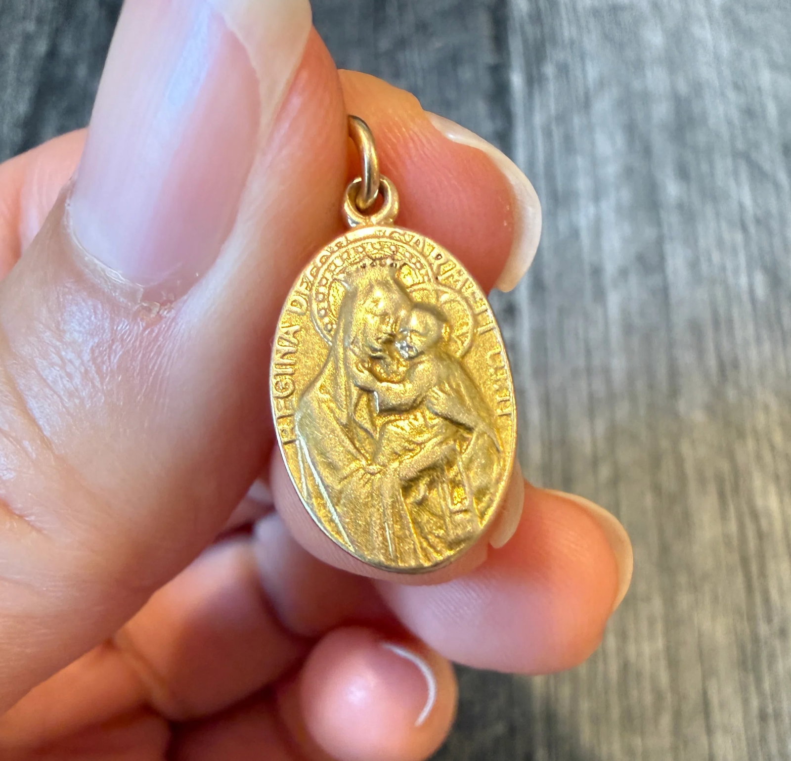Reversible Oval 14K Gold Jesus and Mary and Child Medal Charm: Metal: 14K Yellow Gold Weight: 2.8 gramsMeasurements: 0.7 inches long by 0.45 inches wideCondition: In very good condition with some minor surface wear.Follow us on Instagram @alphaomegajewelry for th
